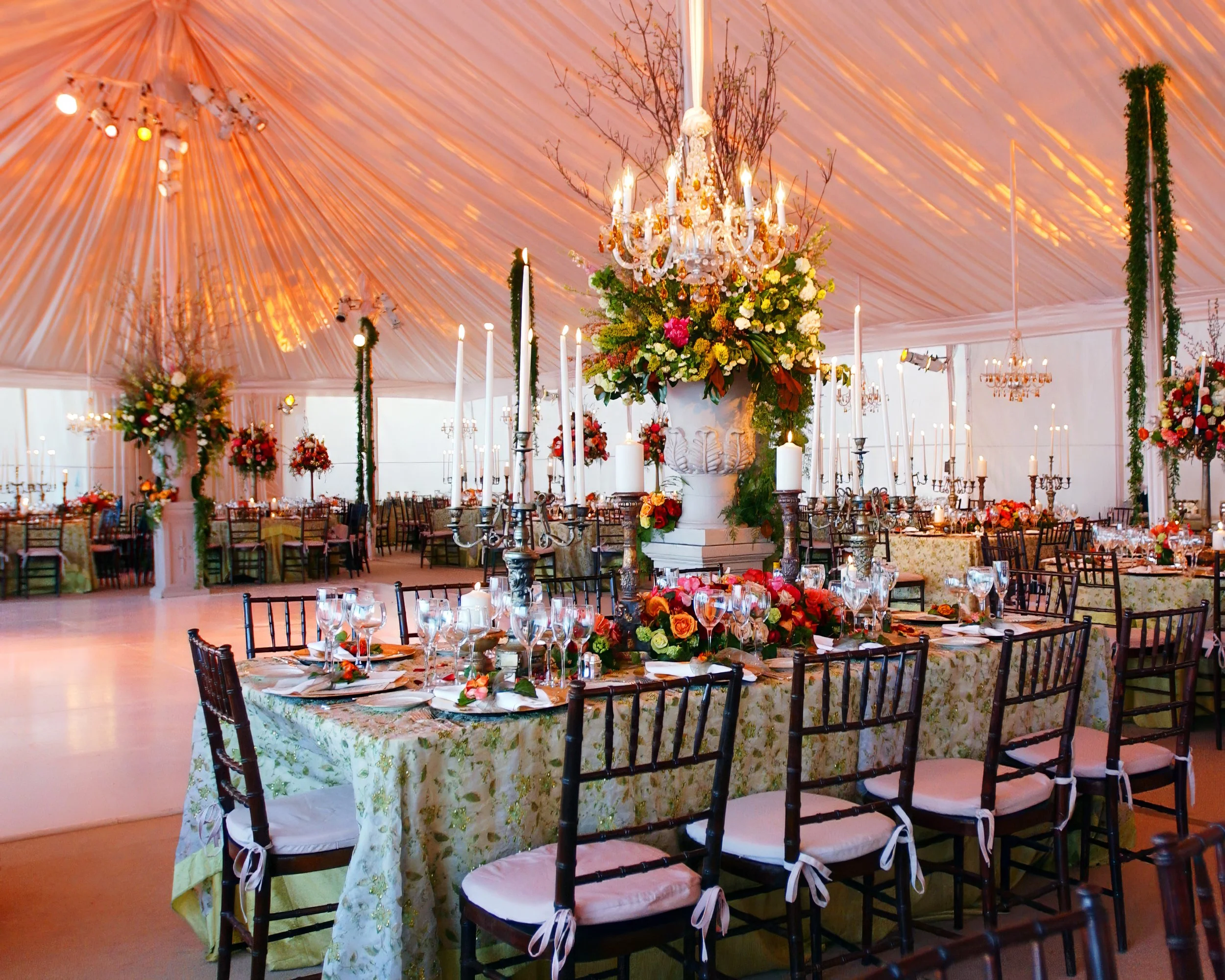 Lavish tented wedding reception with floral and decor by David Tutera in Fairfield County, Connecticut.