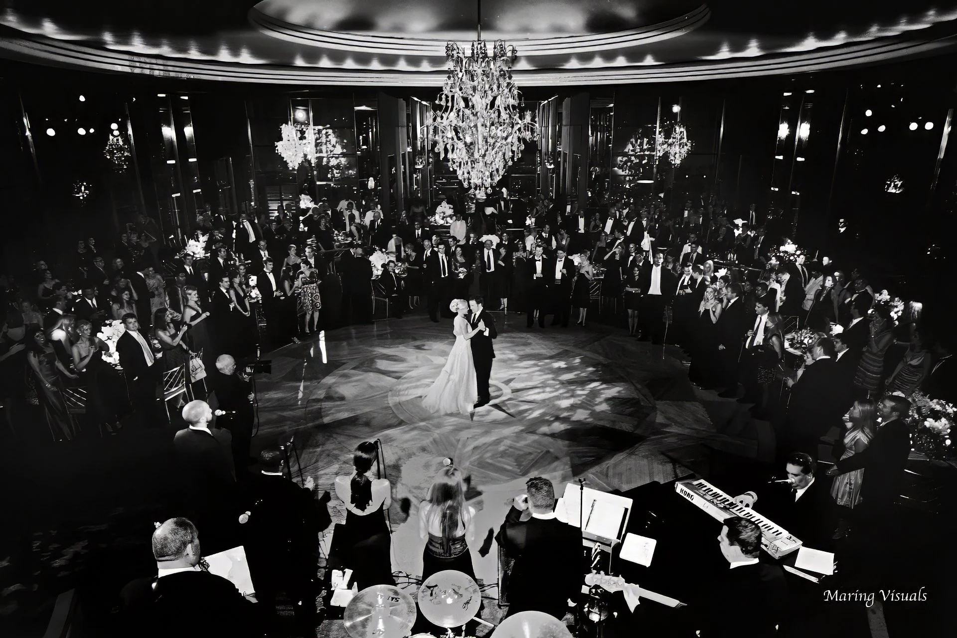 Sweeping view of bride and groom sharing their first dance at the Rainbow Room wedding reception in New York City.