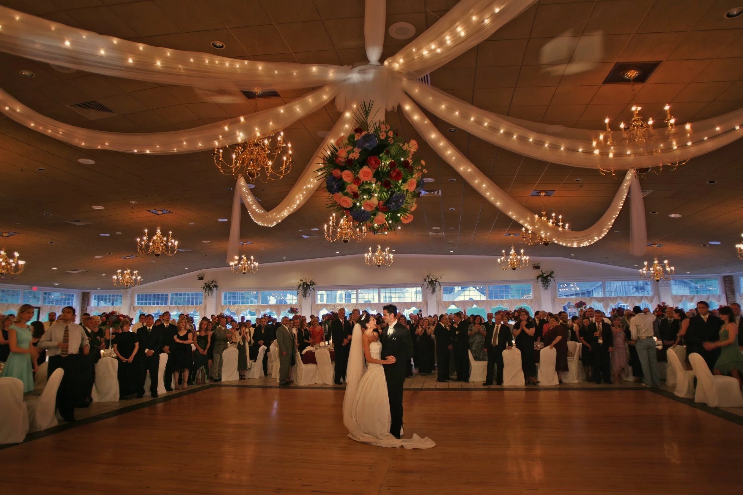 Grand ballroom view of bride and groom first dance at Aqua Turf Club in Southington Connecticut.