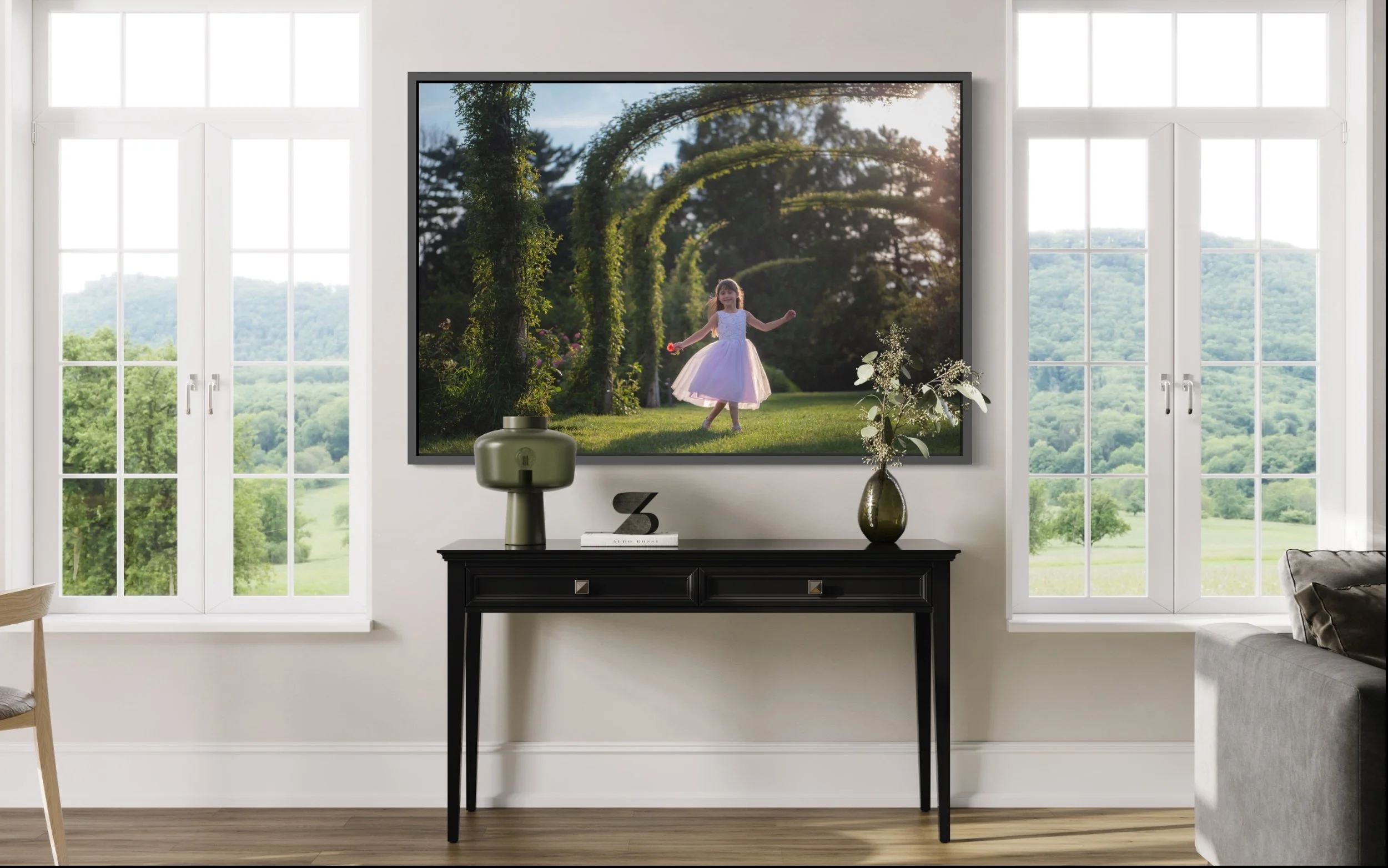 Framed portrait of a young girl playing in a rose garden displayed inside a family home.