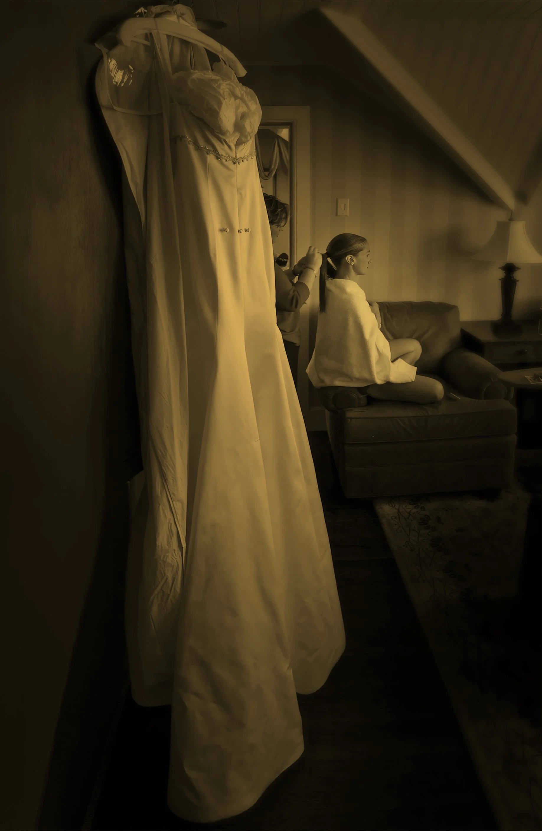 Bride’s wedding dress hanging elegantly as she prepares for the day at Castle Hill.