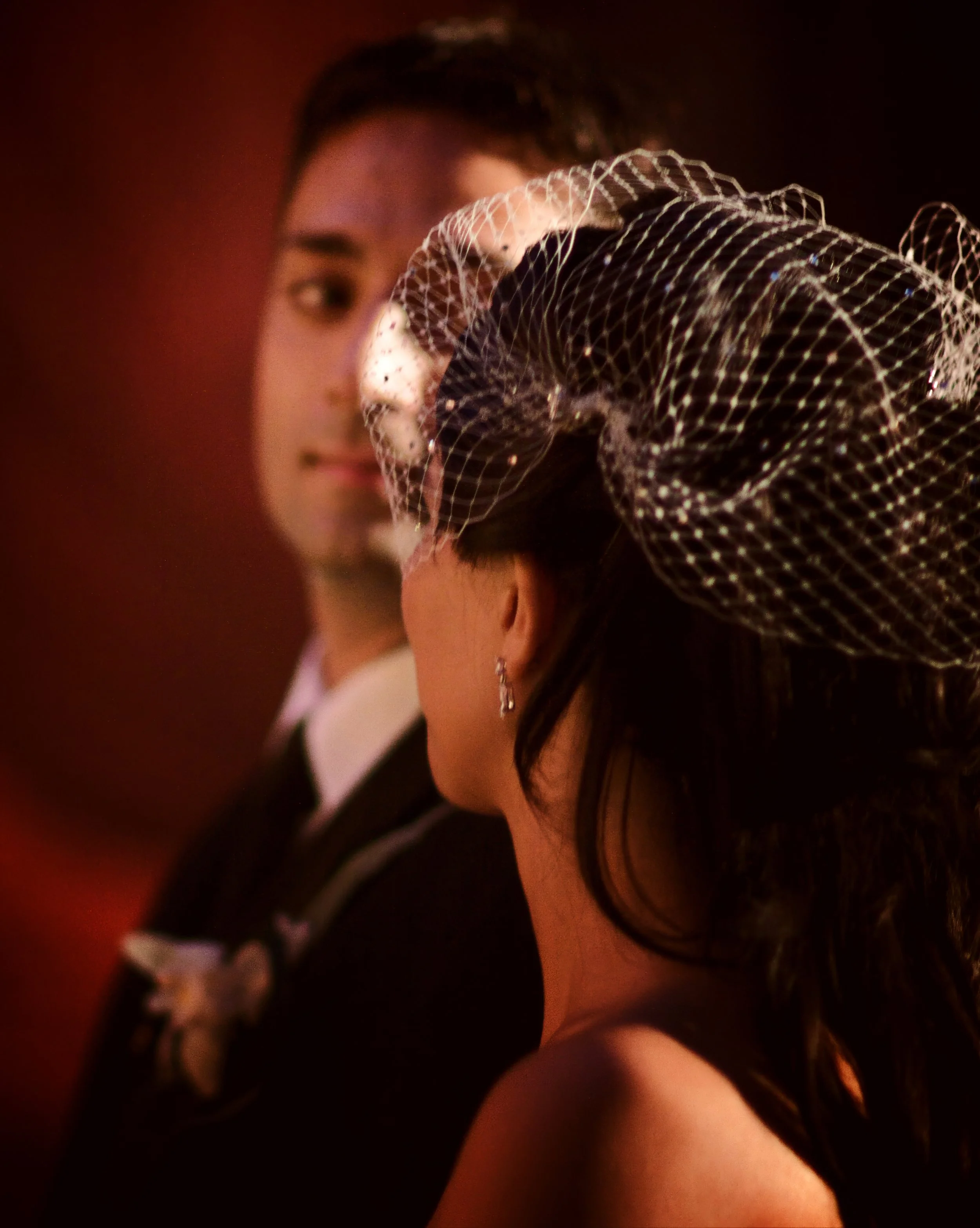 Groom gives the bride a thoughtful glance during their wedding ceremony at Angel Orensanz in Manhattan.