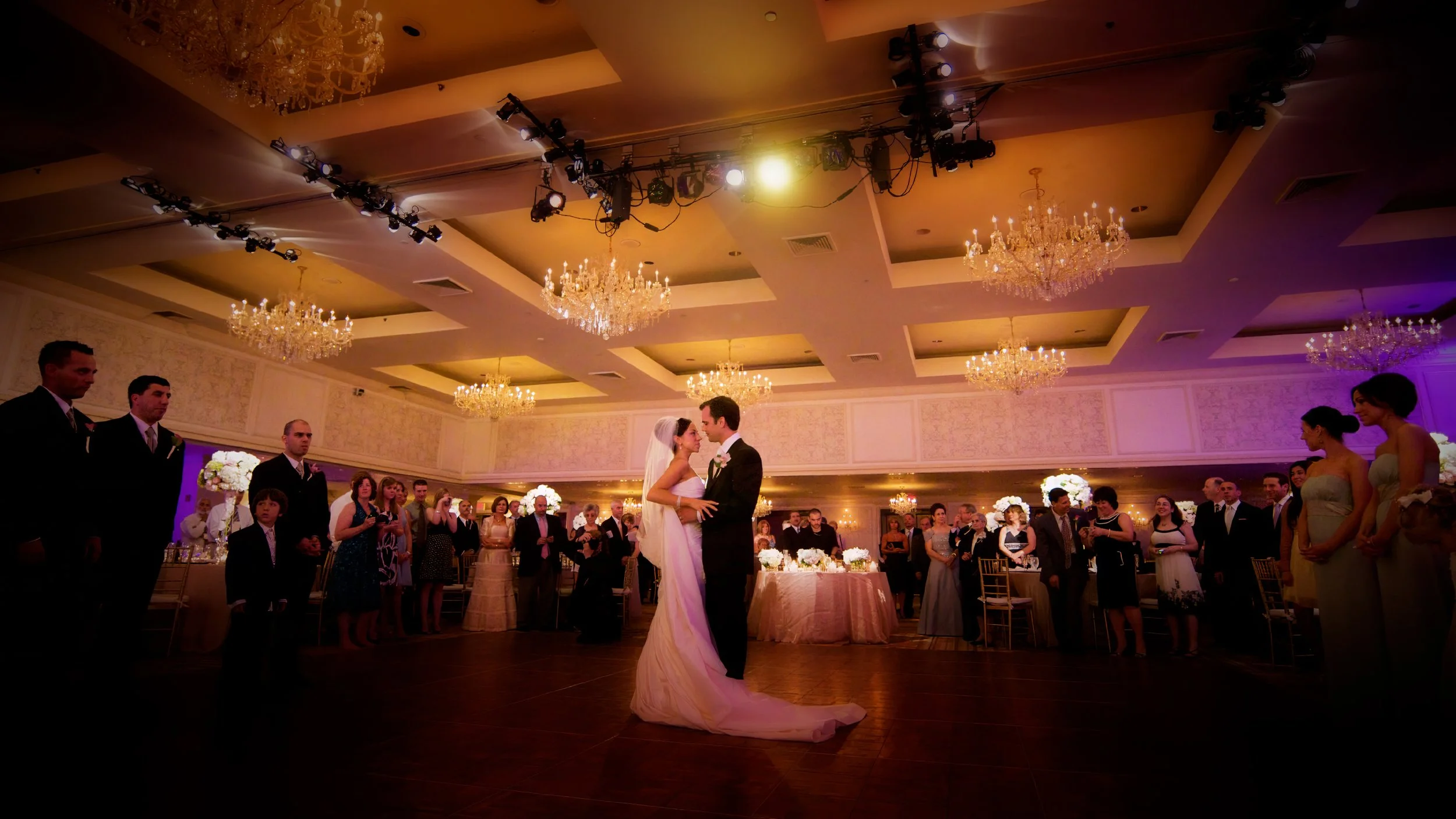 Wide-angle view of the first dance on the Omni New Haven Hotel ballroom dance floor.