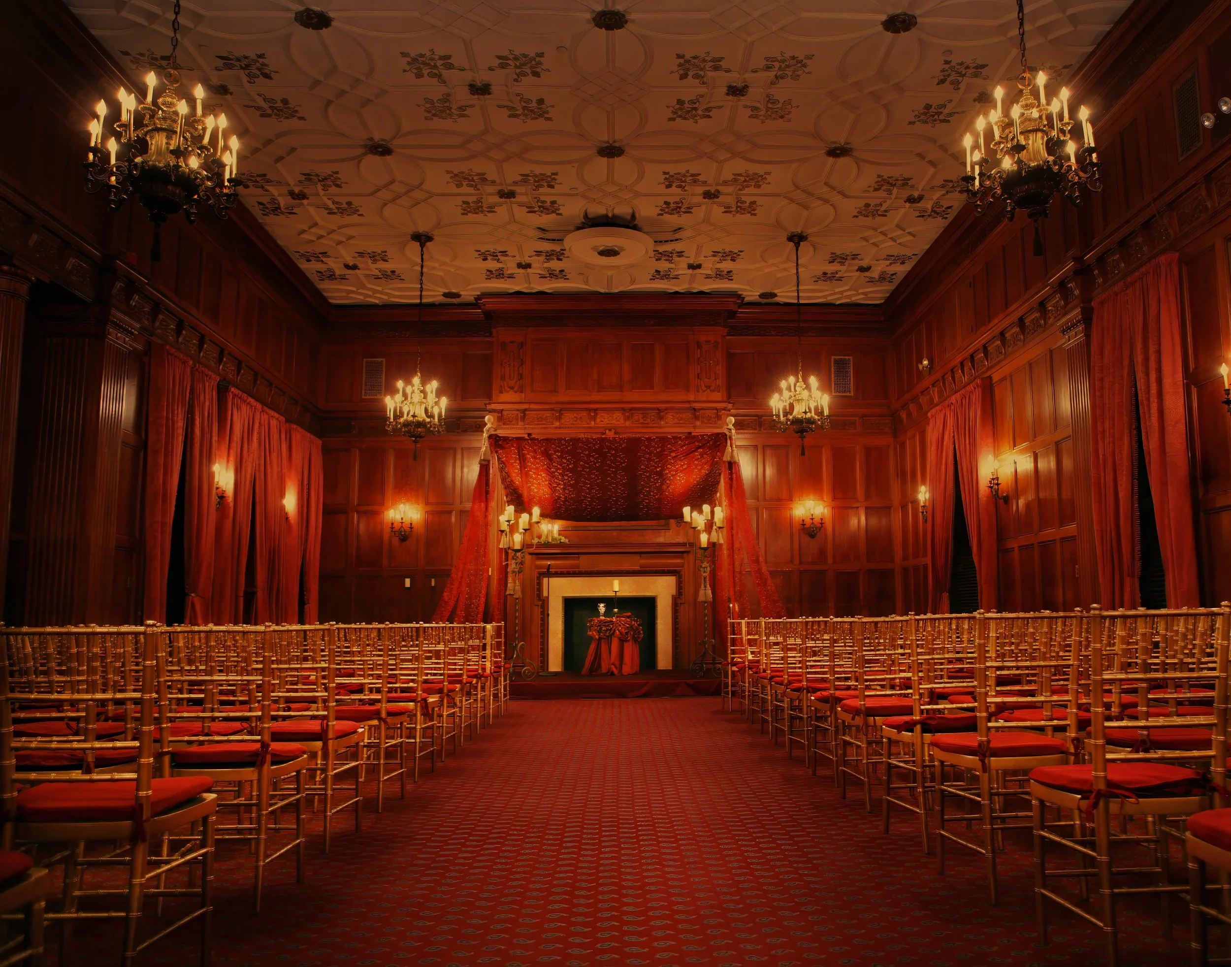 Ballroom adorned with candlelight during a wedding ceremony at the Harmonie Club in Manhattan