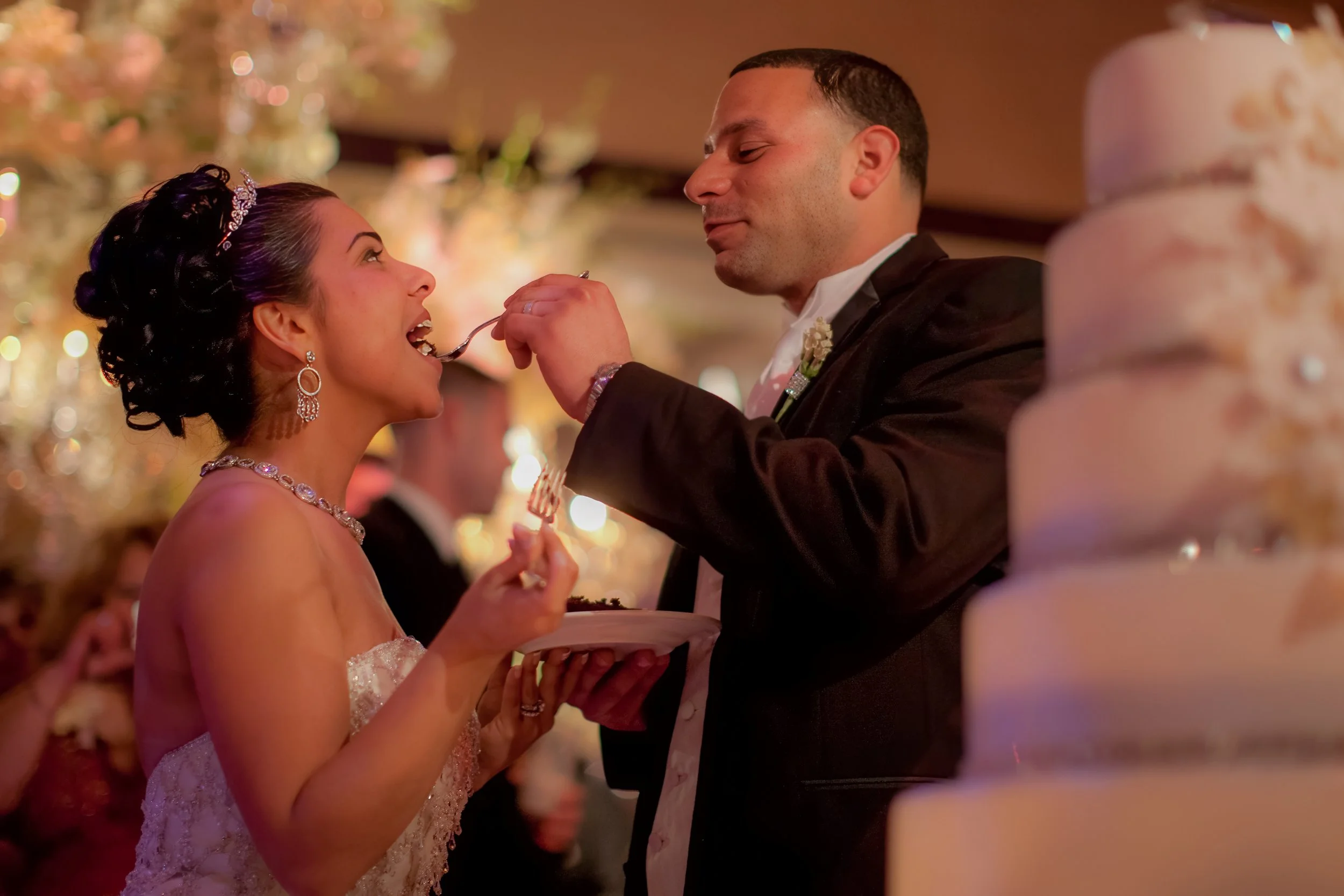 Groom feeds the bride a bite of their wedding cake at The Palace at Somerset Park.