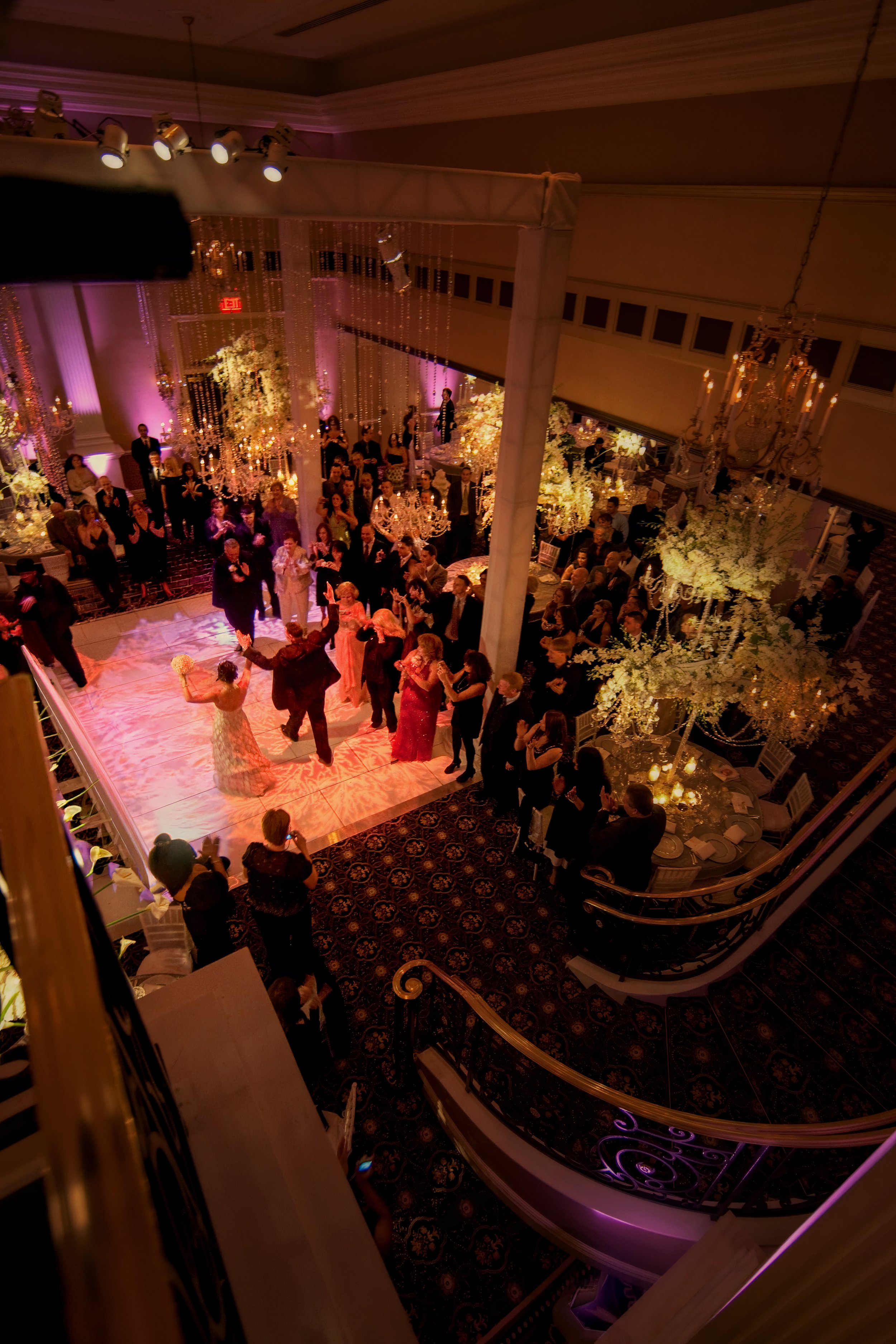Bride and groom make a grand entrance into the wedding reception at The Palace at Somerset Park.