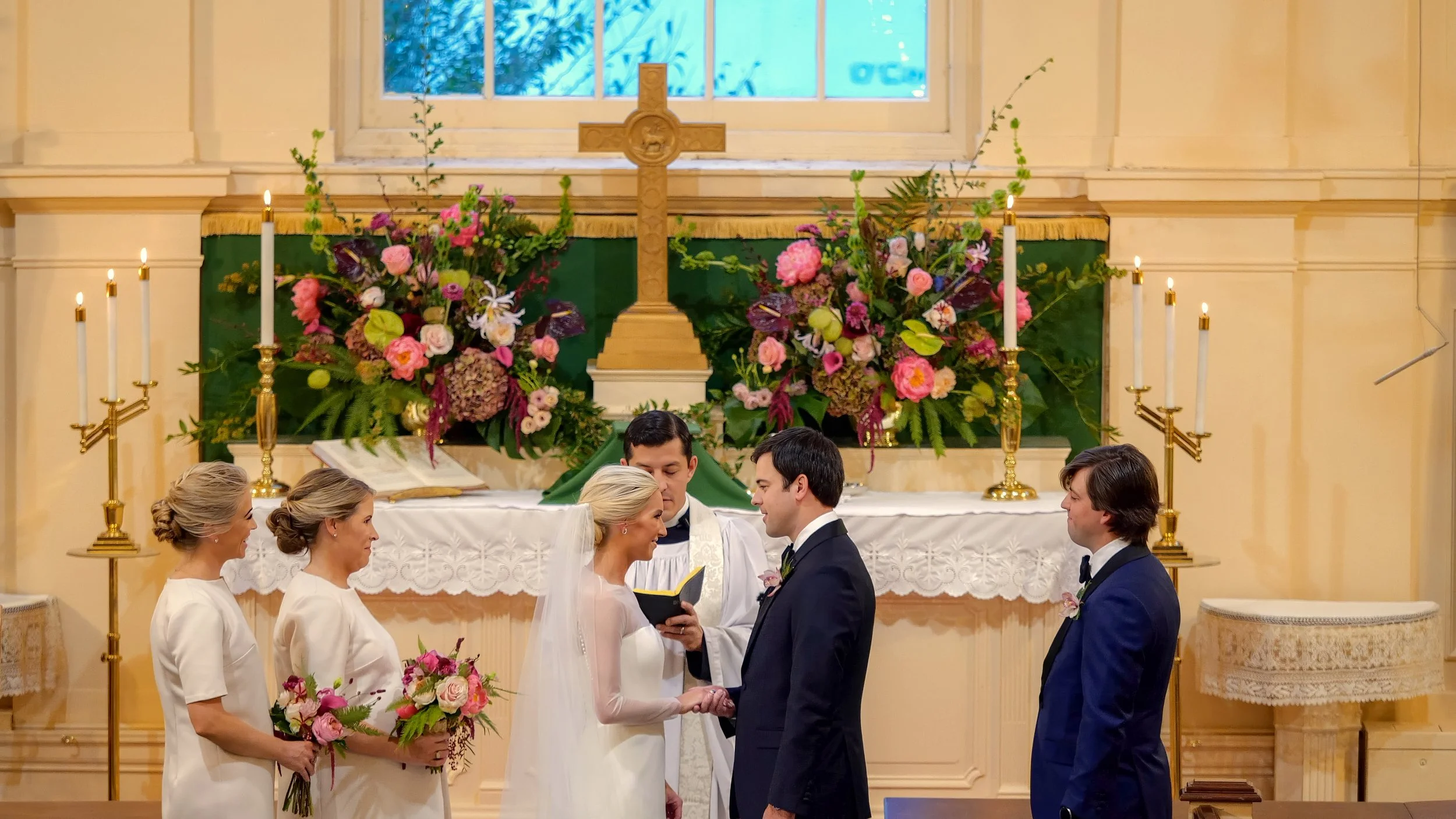 Bride and groom exchange vows during their wedding ceremony in the Pinehurst Village Chapel.