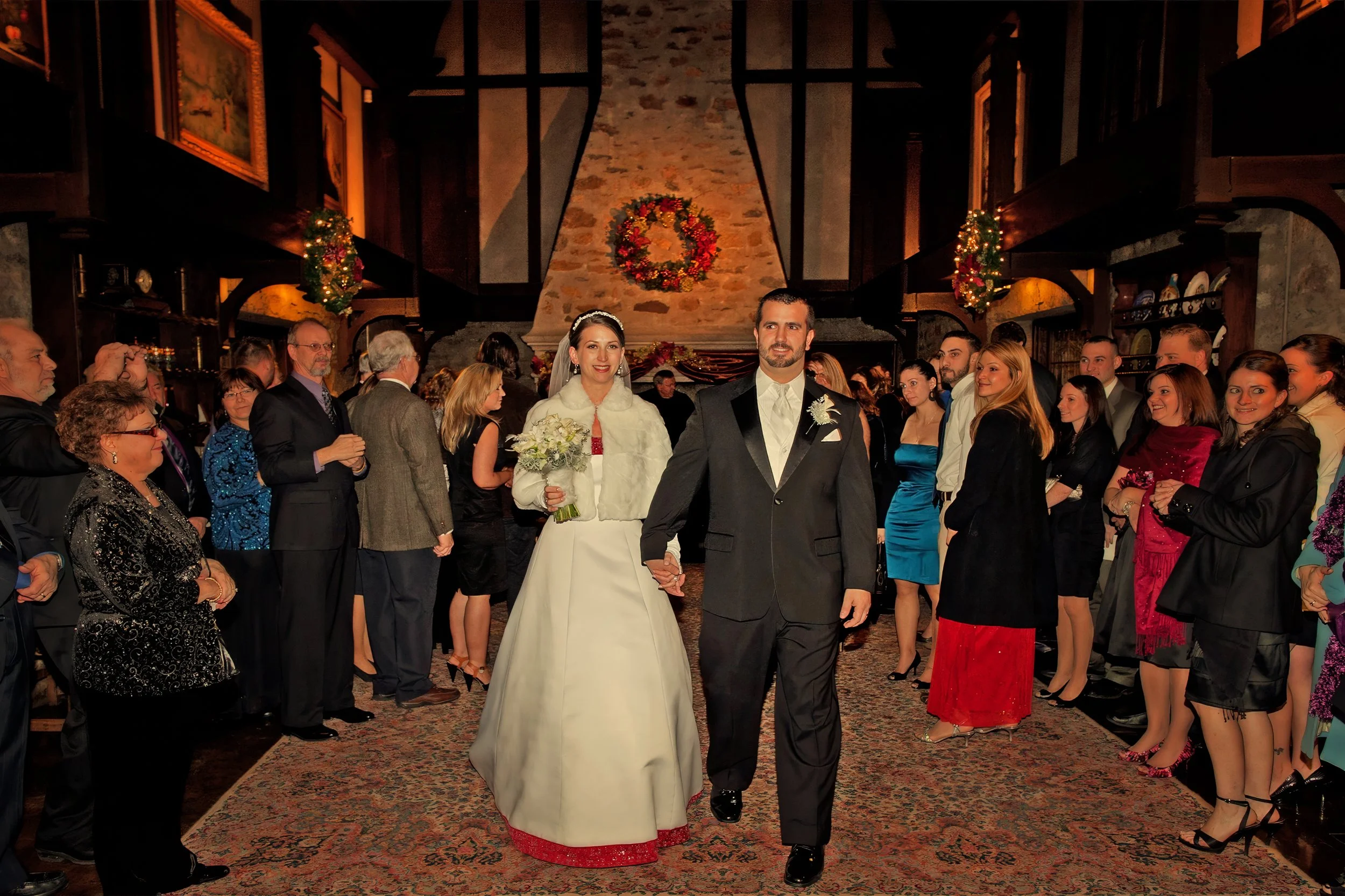 Bride and groom exiting the Gallery after an intimate winter wedding ceremony at Saint Clements Castle