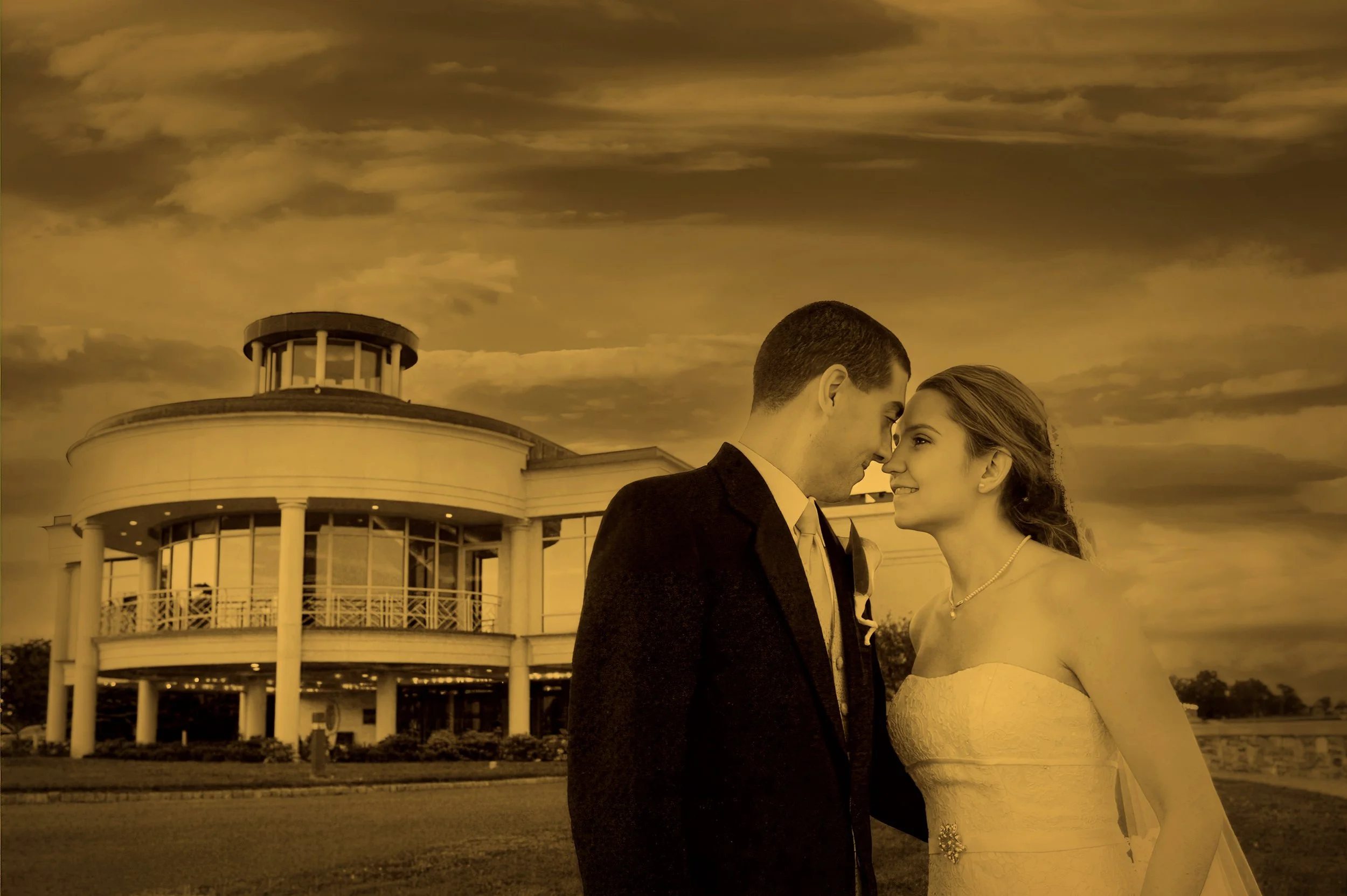 Bride and groom in a fine art architectural portrait with Glen Island Harbour Club in the distance