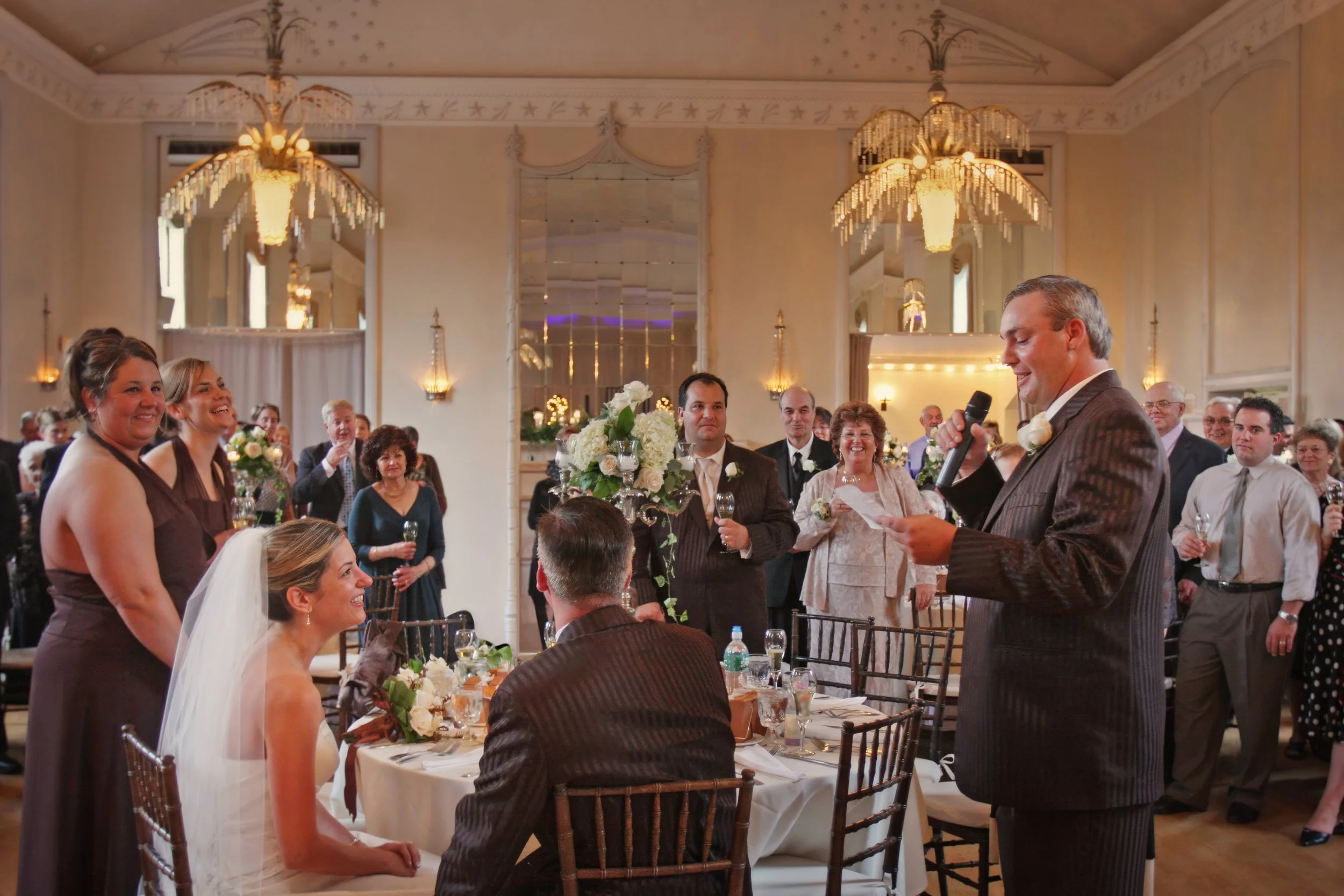 Best man delivers a heartfelt toast as the bride smiles inside the New Haven Lawn Club ballroom.