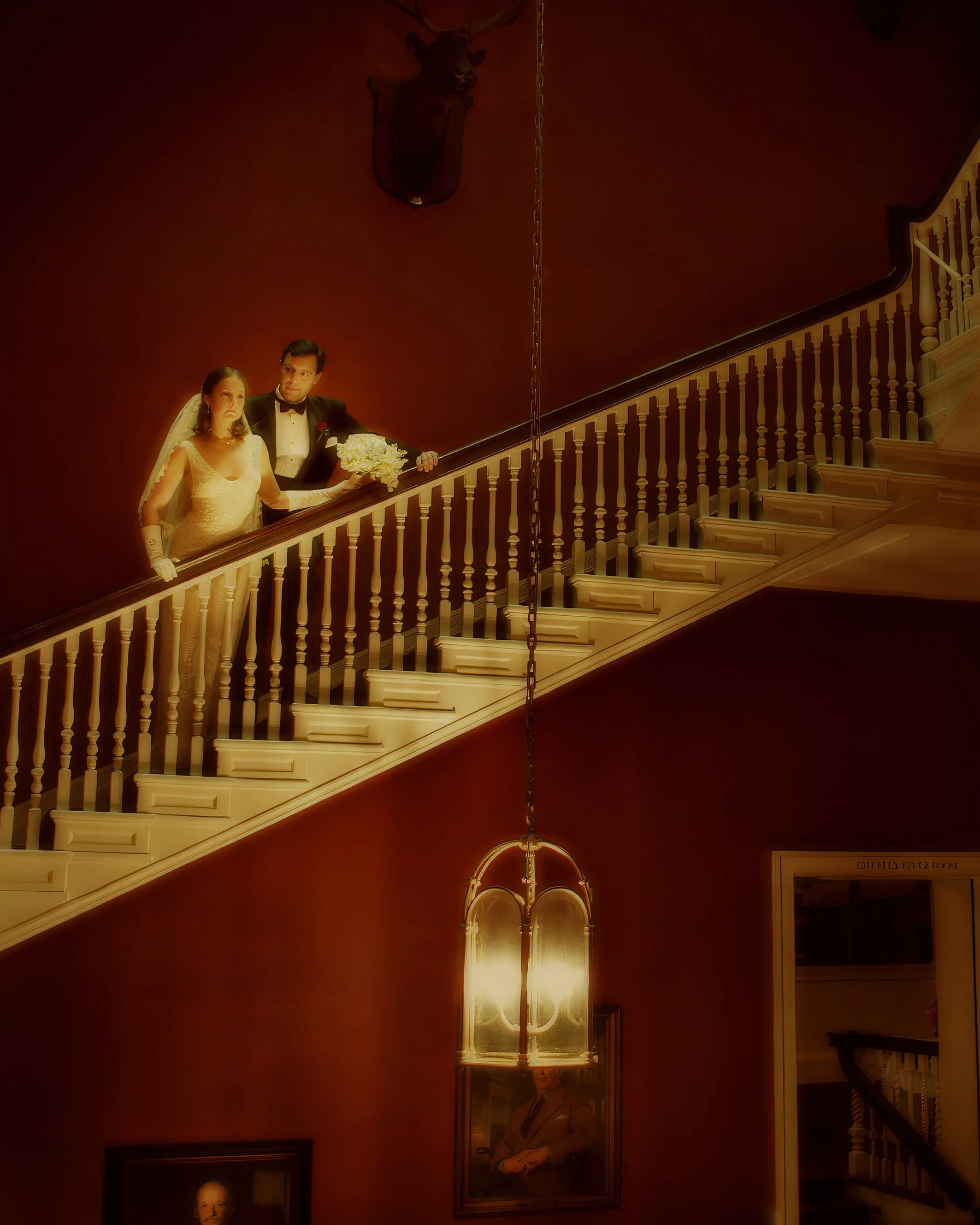 Bride and groom pose elegantly on the grand staircase at The Harvard Club in New York City.
