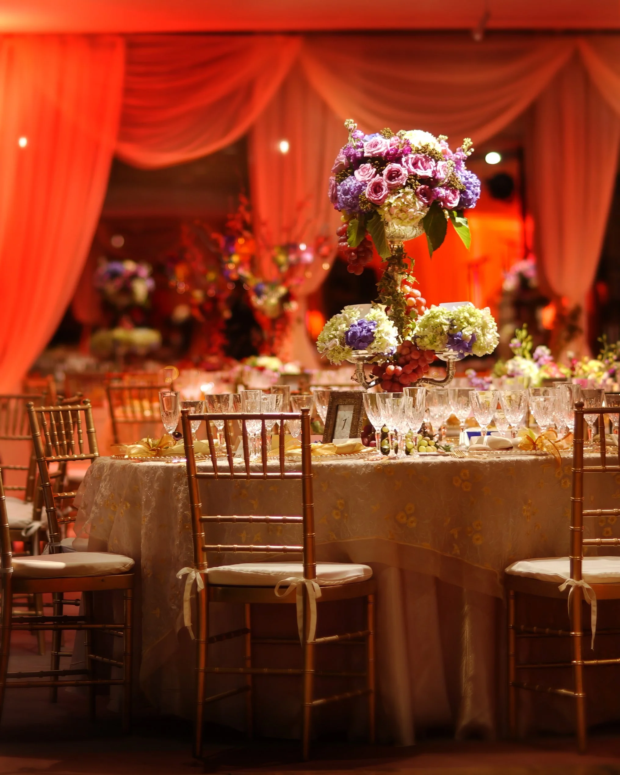 Elegant wedding table settings and décor inside The Farmington Polo Club Aqueduct Room.