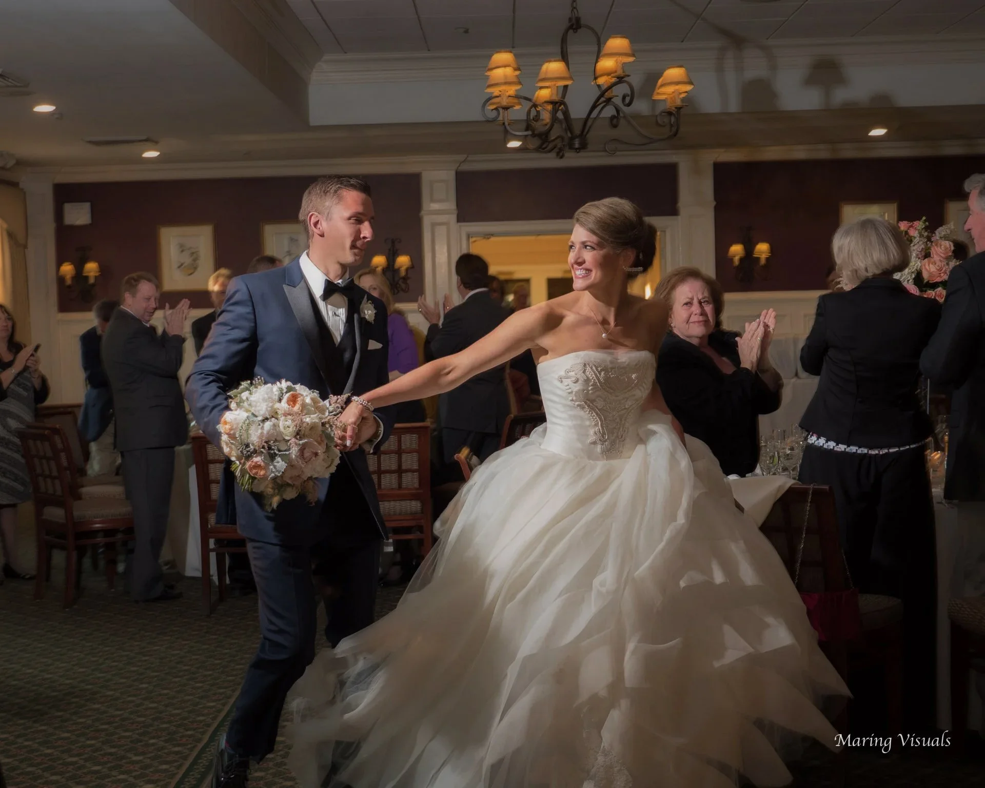 A bride and groom are announced into their reception at Salem Golf Club in Westchester New York