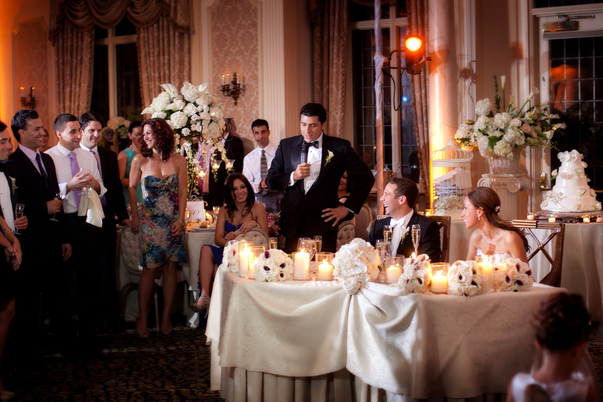 Best man gives a heartfelt toast while guests smile during the wedding reception at Pleasantdale Chateau.