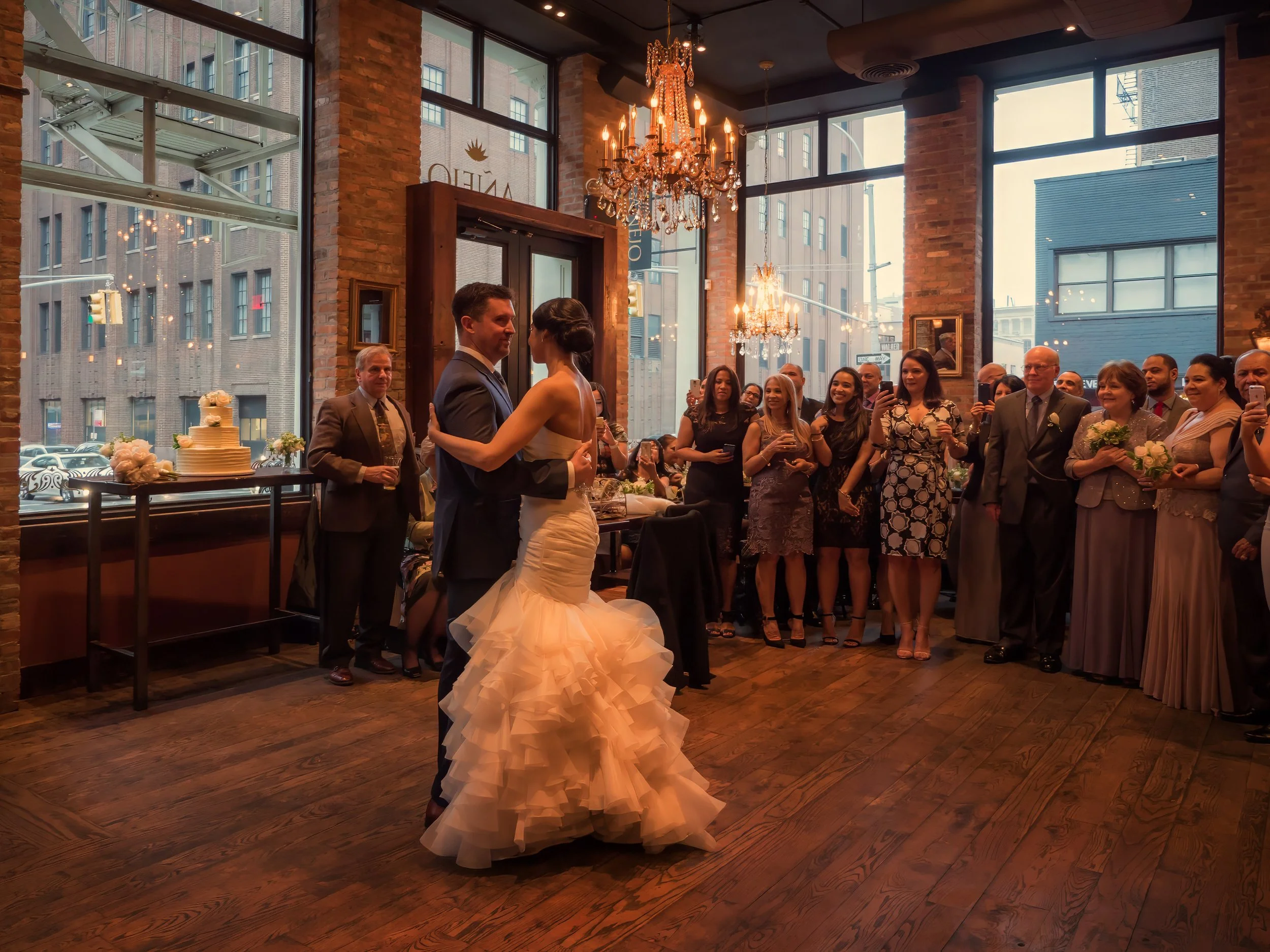 Cinematic view of bride and groom sharing their first dance at Añejo NYC wedding reception.