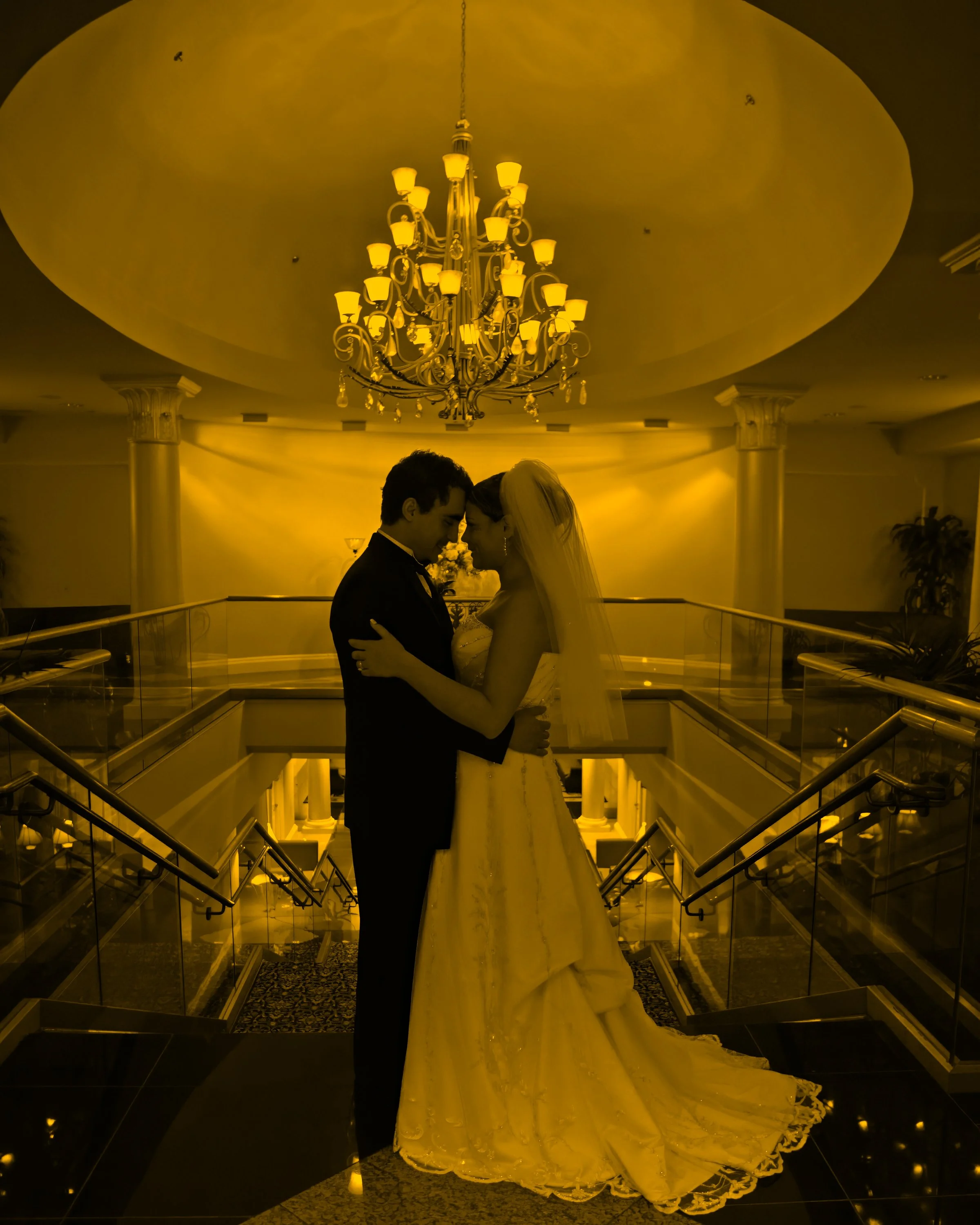 Fine art portrait of a bride and groom on the grand staircase at Waterview in Monroe, Connecticut