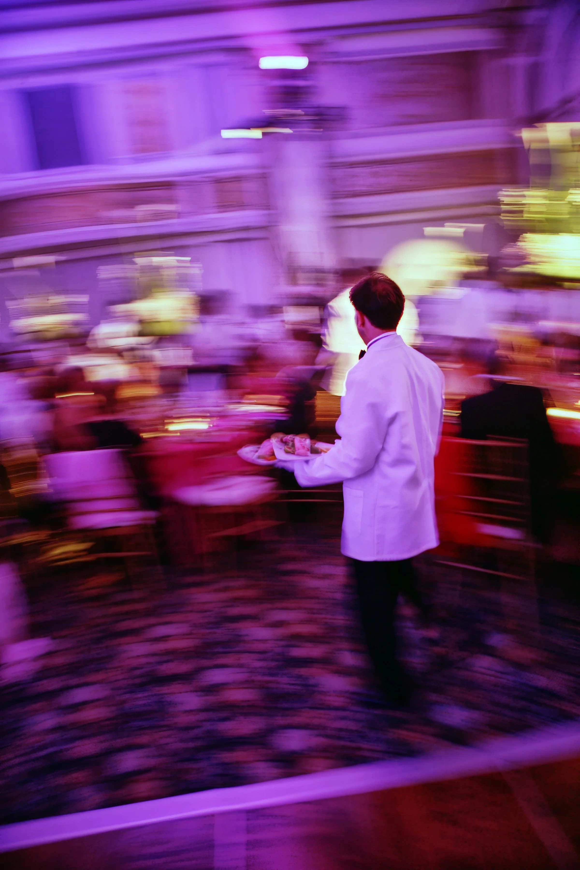 Waiter moves through the ballroom at Cipriani Wall Street