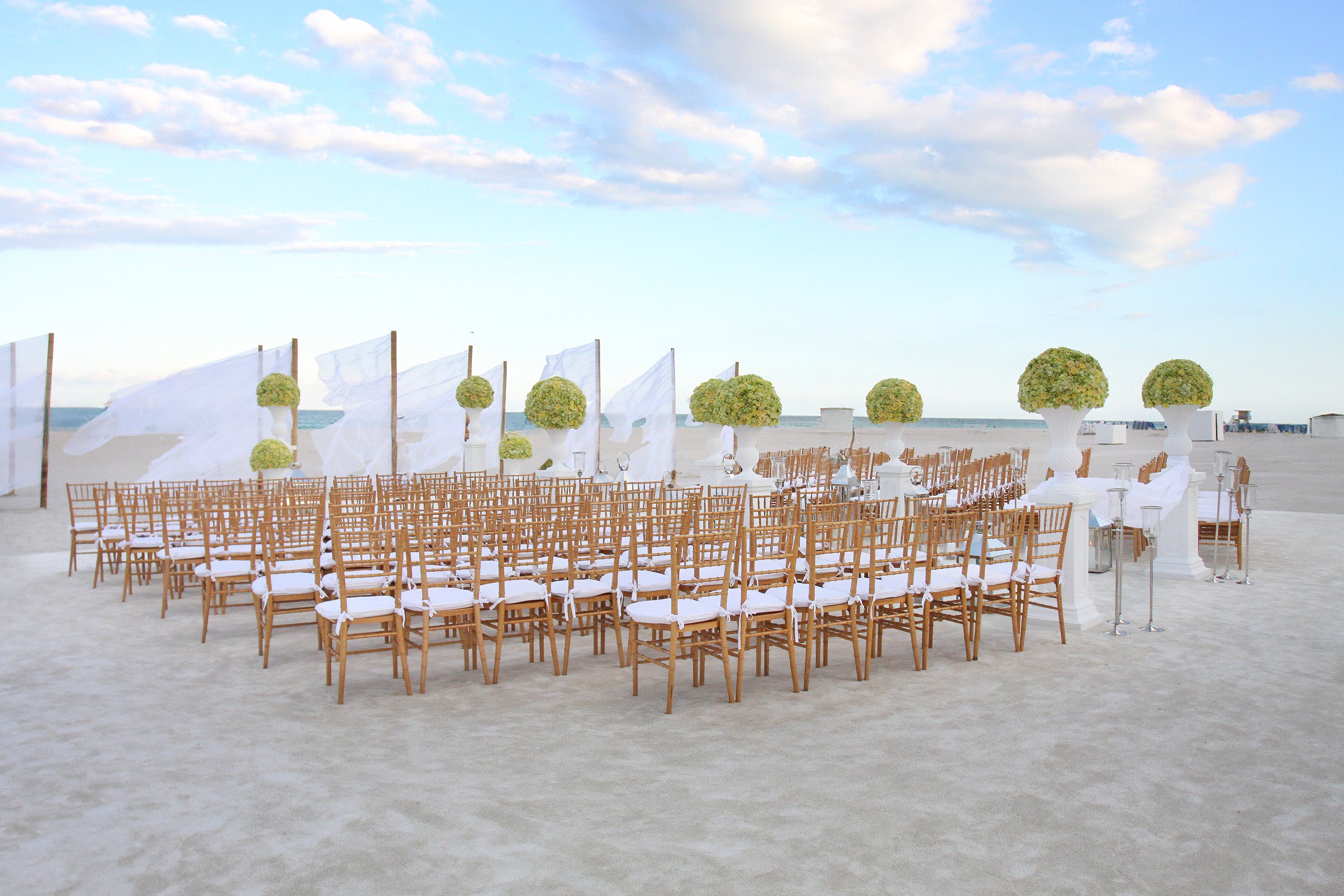 Luxury Florida beach wedding decor designed by David Tutera with elegant coastal styling