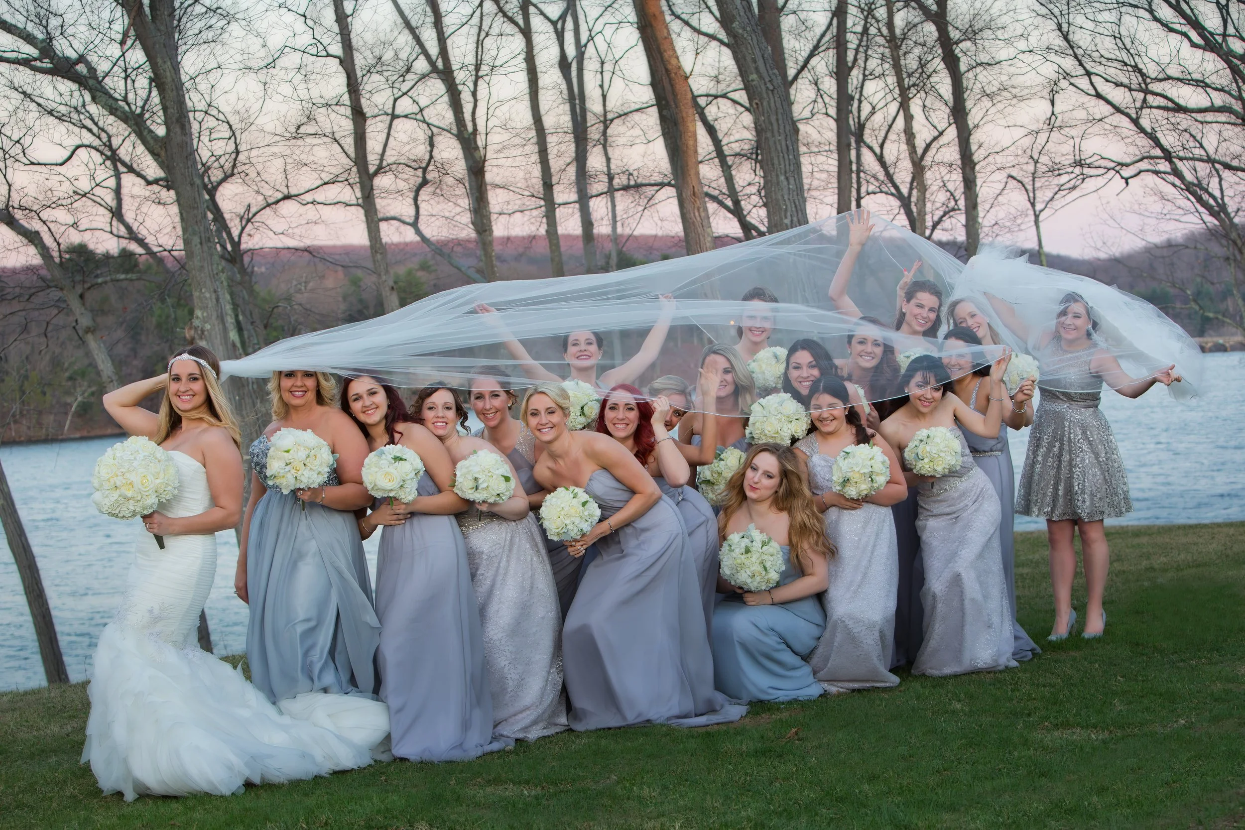 Bridesmaids candid overlooking Lake Zoar in Monroe, Connecticut at Waterview wedding venue