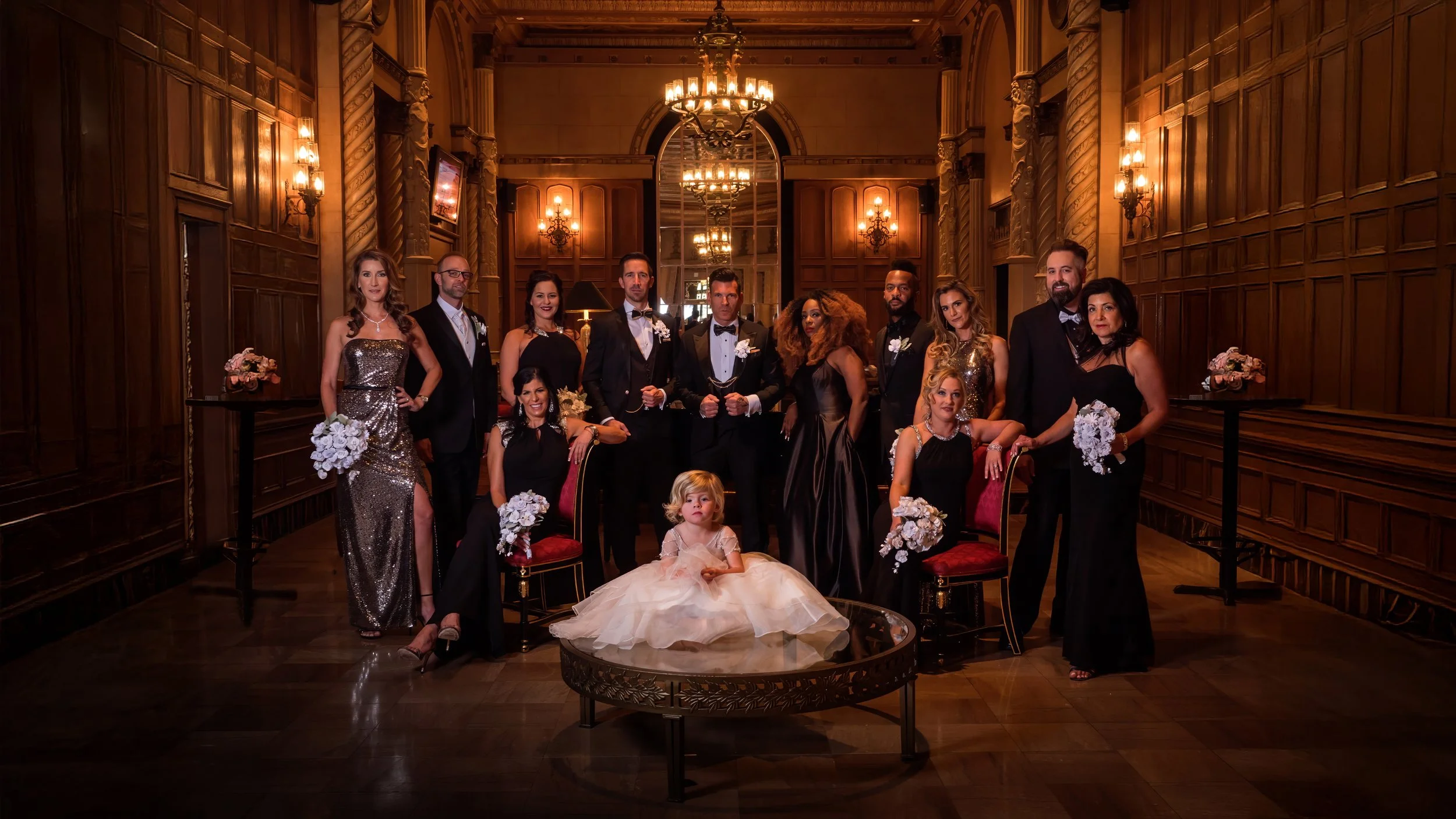 Fashion-forward bridal party portrait in the lounge of the Millennium Biltmore Hotel Los Angeles at celebrity planner David Tutera’s personal wedding.