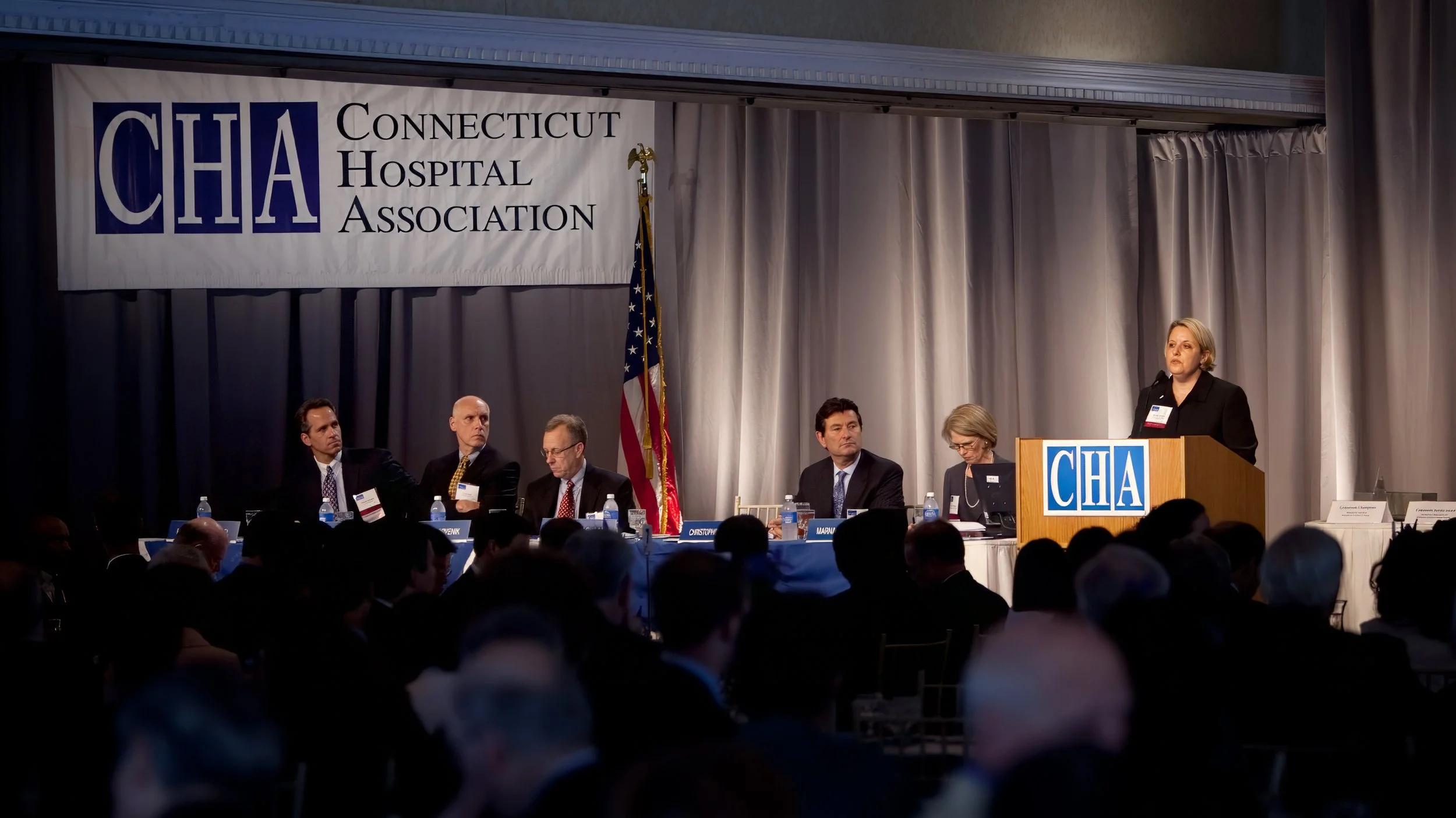 Guests attending a corporate event at the Aqua Turf Club in Connecticut, enjoying networking and presentations.