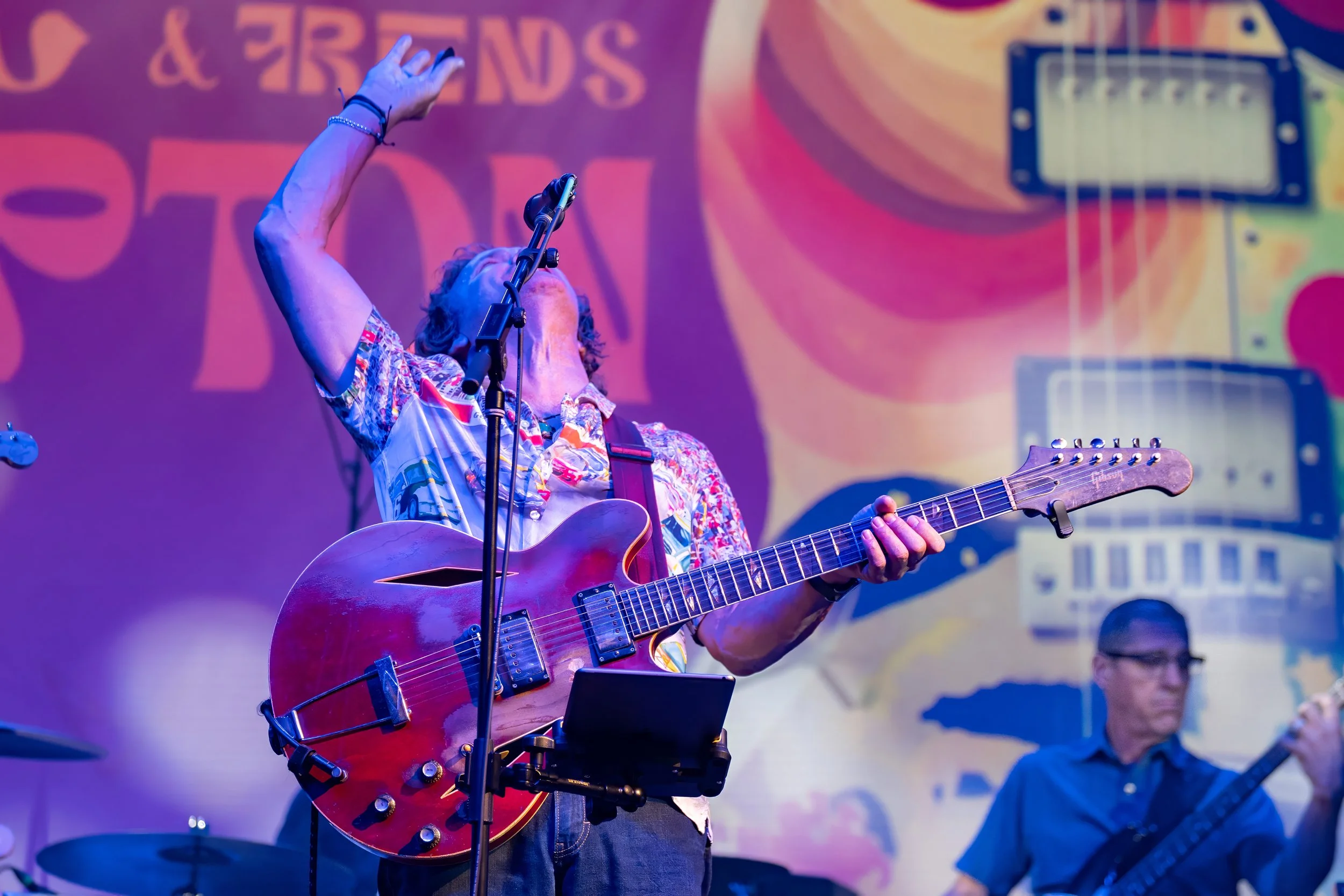 Savannah blues guitarist Eric Culberson performing an energetic live set on stage at Tybee Post Theater
