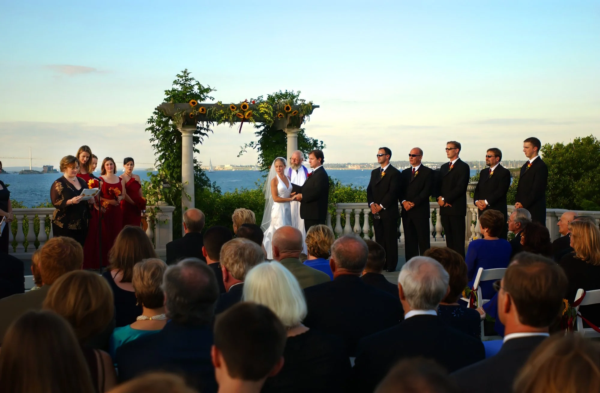 Bride and groom sharing a heartfelt ceremony moment overlooking Narragansett Bay at Castle Hill Inn in Newport Rhode Island.