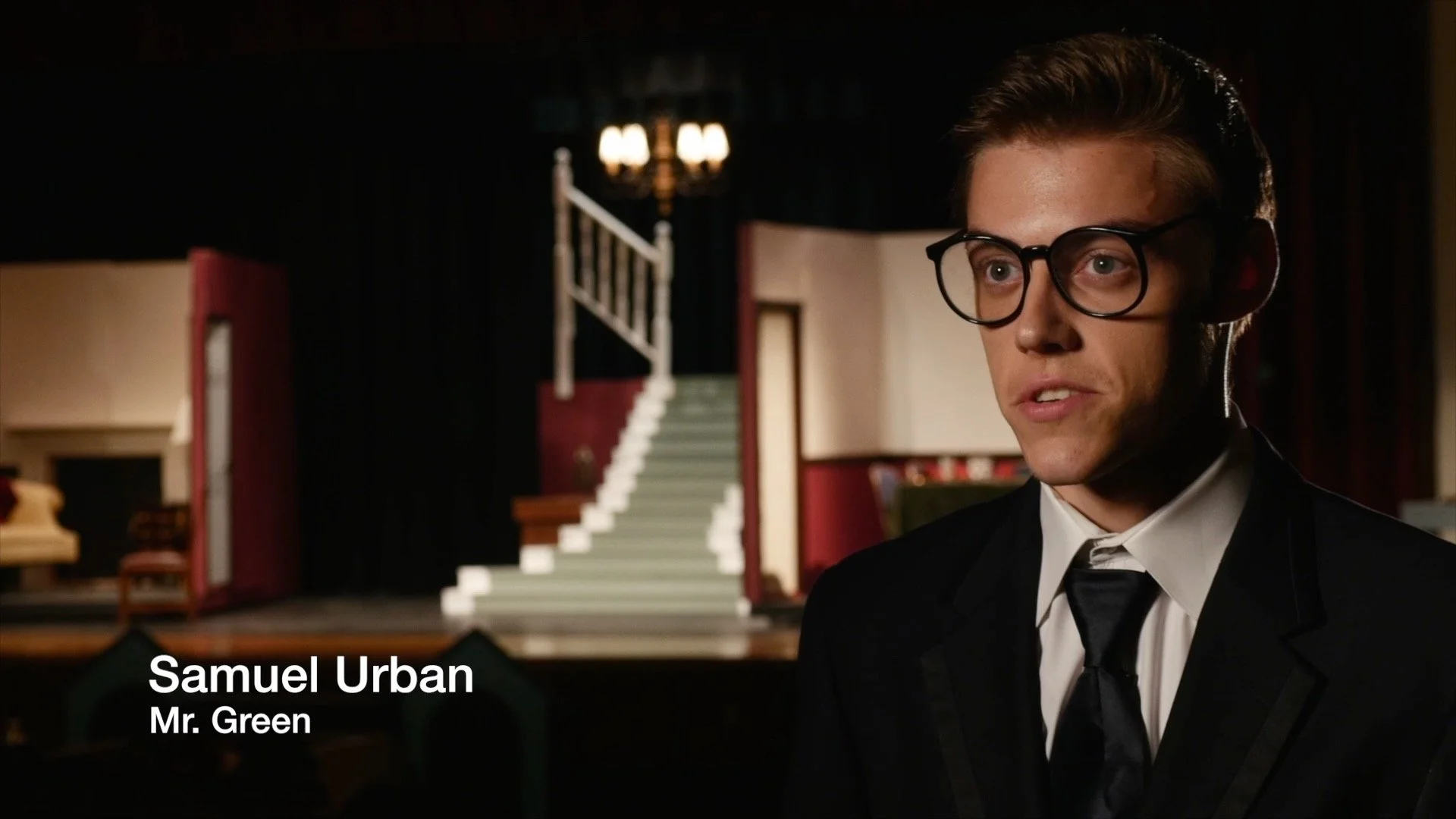 Samuel Urban as Mr. Green during a professionally lit actor interview filmed on the set of Sheehan High School's production of Clue.