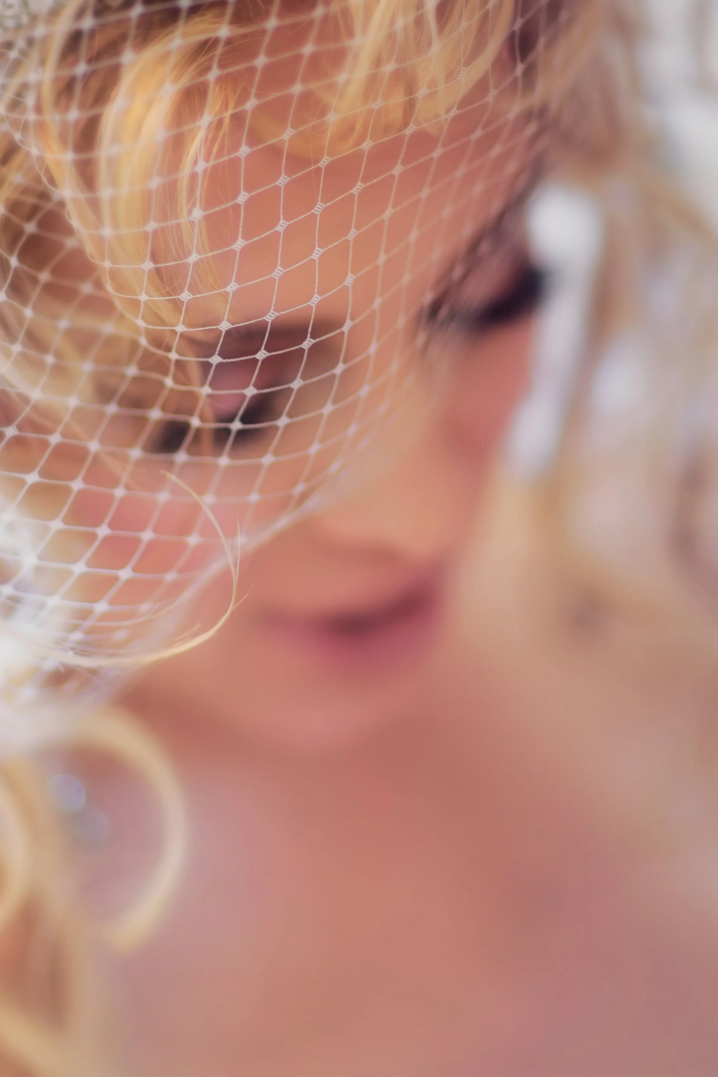 Bridal portrait at The Ritz-Carlton Sarasota highlighting the bride’s veil during getting ready moments.
