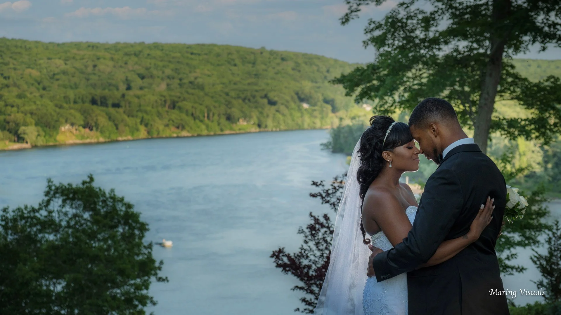 Bride and groom overlooking Connecticut River during Saint Clements Castle wedding reception