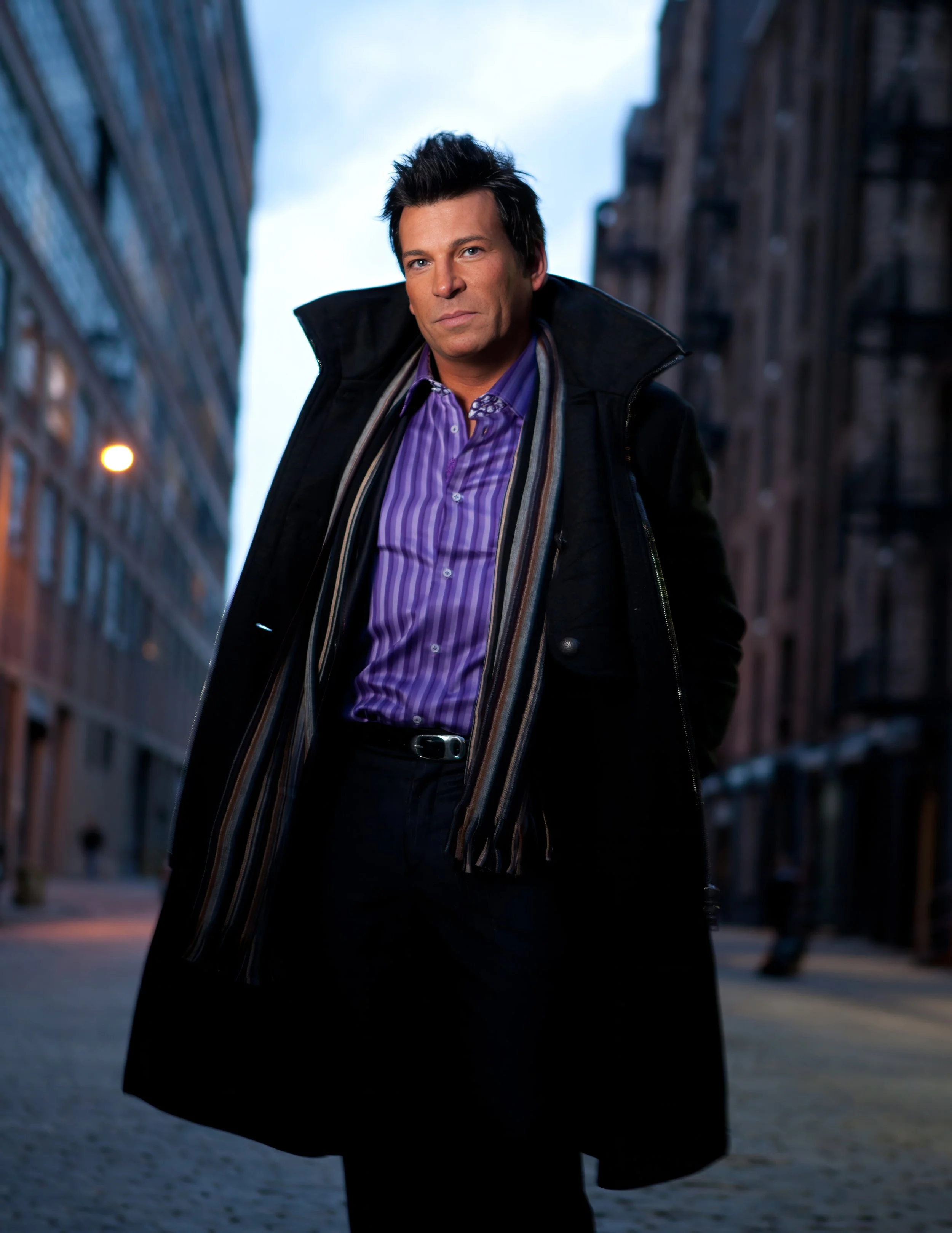 Male celebrity posing in West Chelsea streets of New York City for editorial fashion session