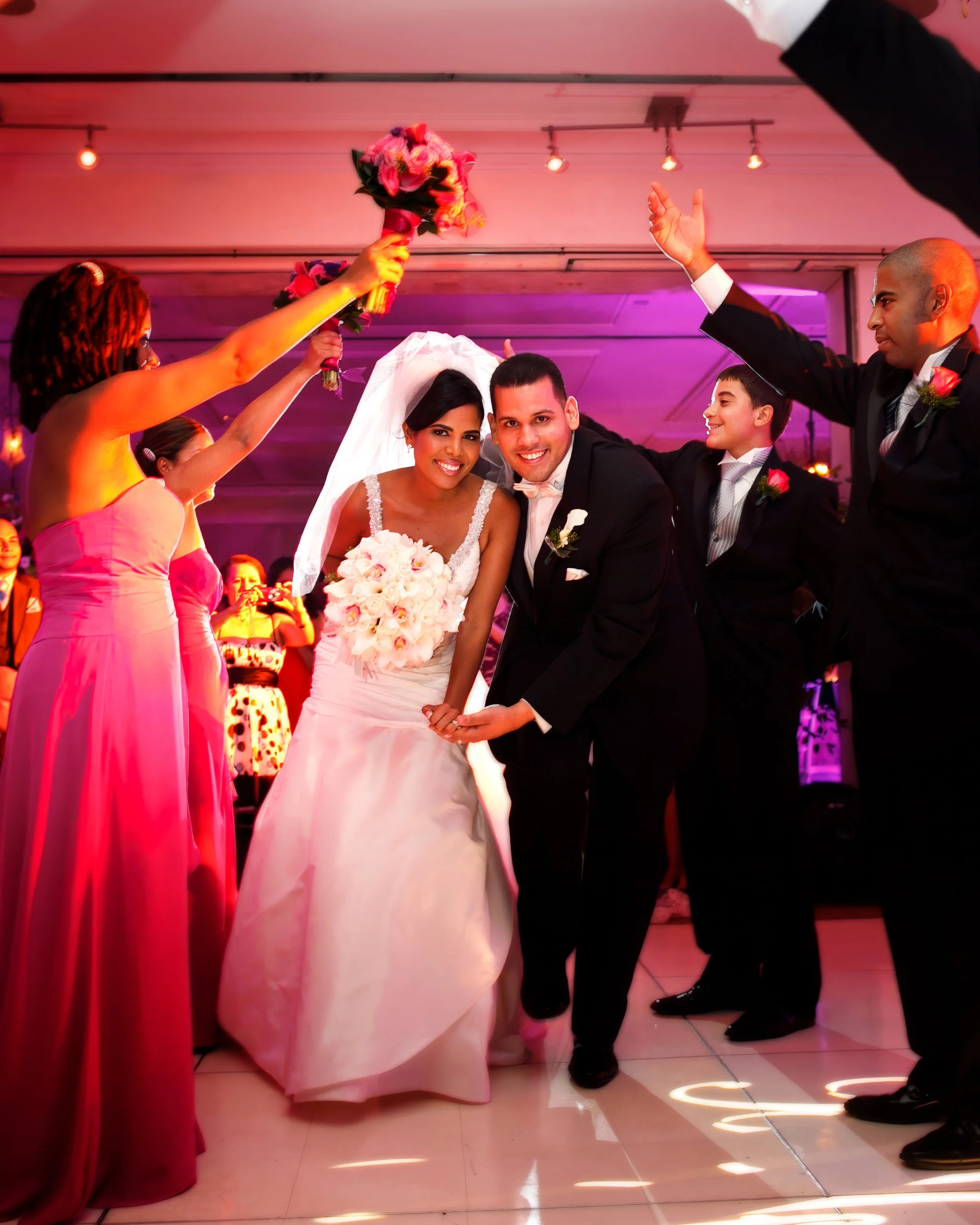 Bride and groom grand entrance into wedding reception at Delamar Greenwich Harbor in Greenwich, Connecticut.
