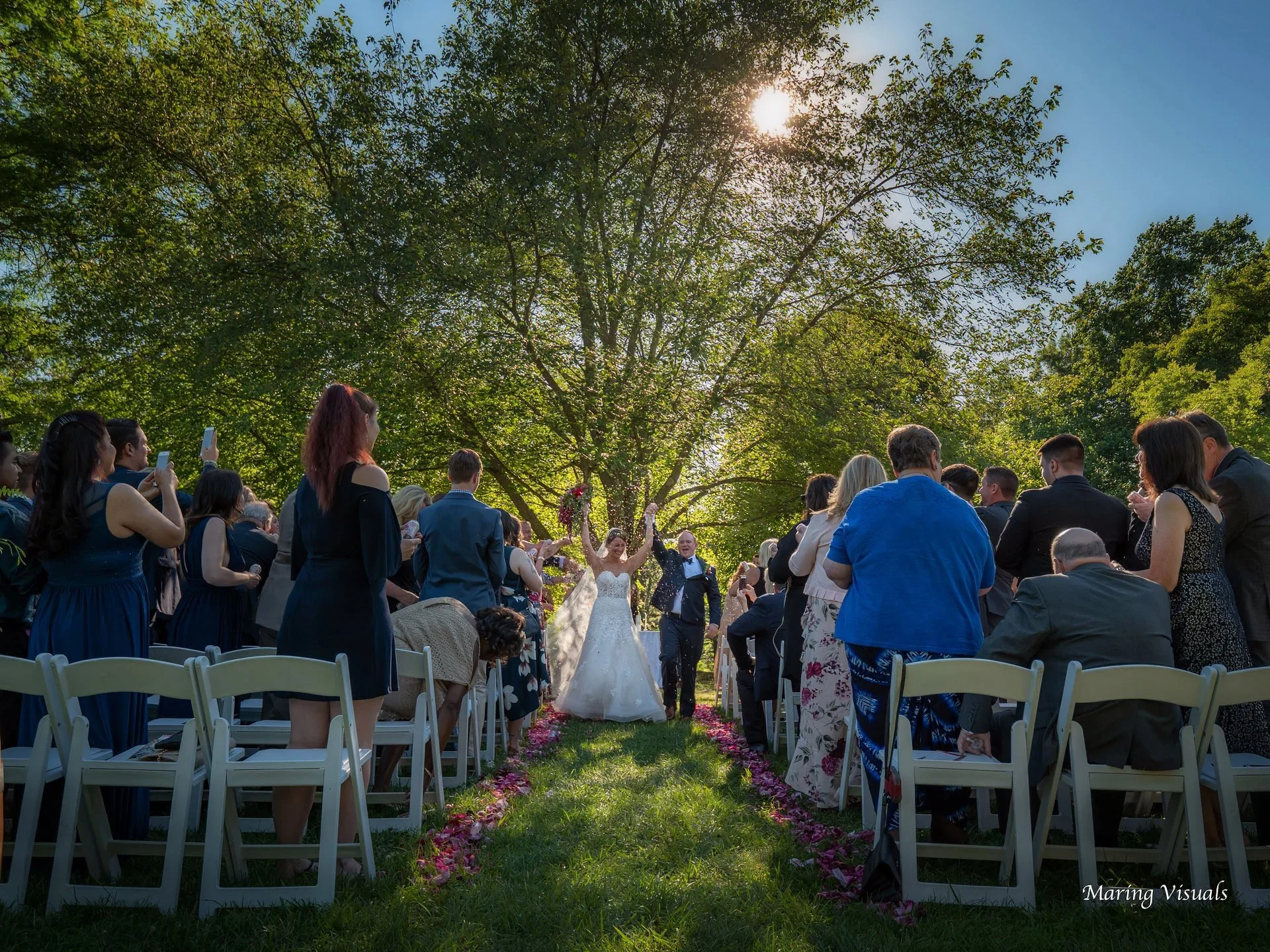 Wedding ceremony held under oak trees at Whispering Oaks in Norwalk, Connecticut.