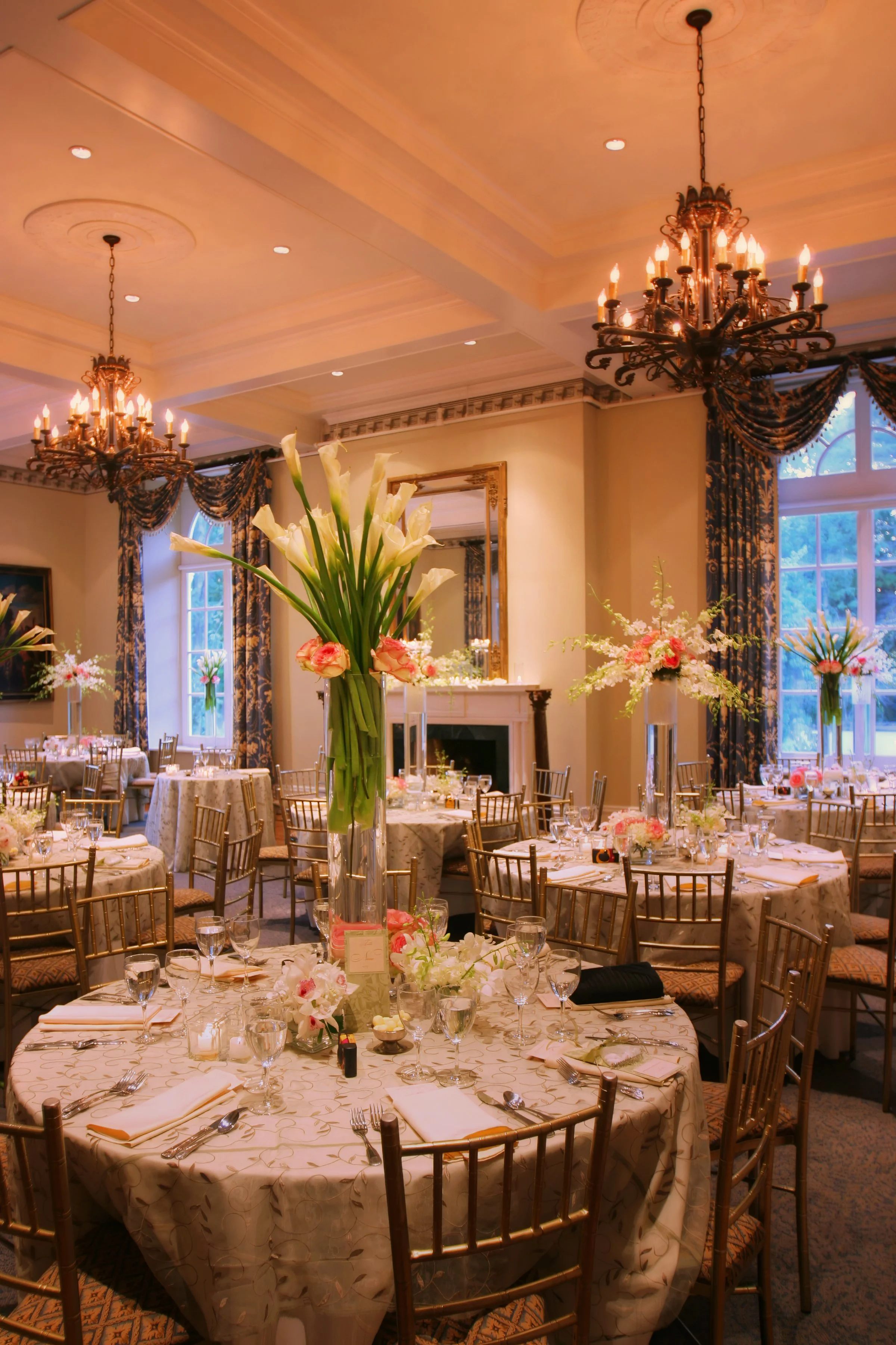 all floral centerpieces and elegant table settings inside the West Wing reception space at Wadsworth Mansion.