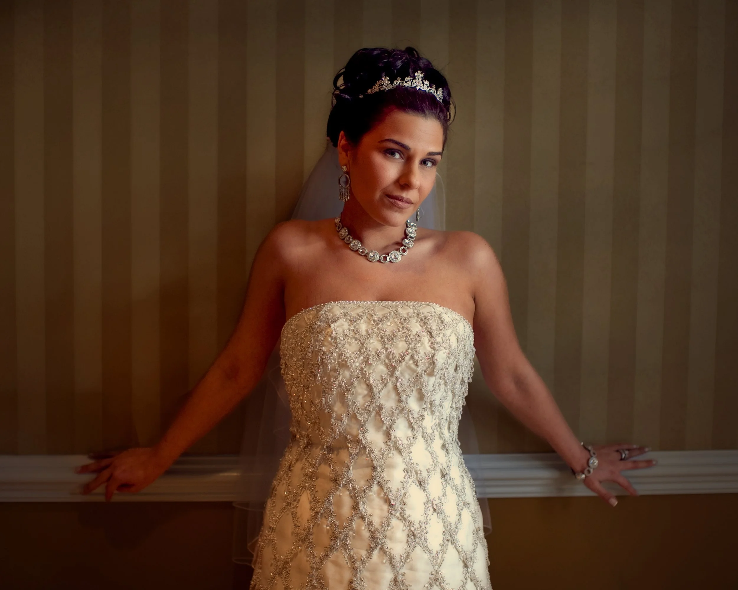 Bride poses for a portrait in the grand hallways of The Palace at Somerset Park.