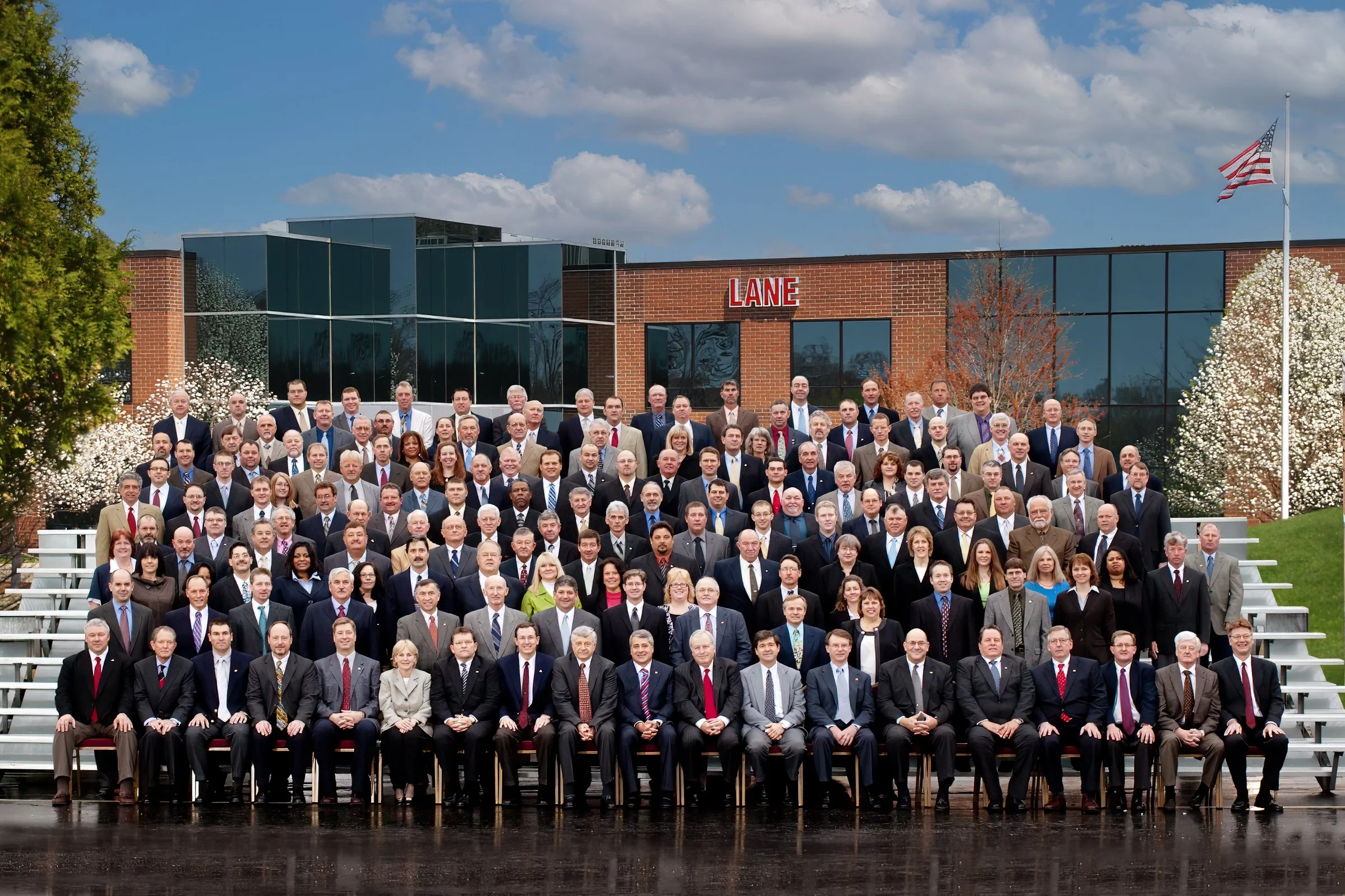 Over 100 executives gathered for a formal group portrait during a corporate retreat in Connecticut.