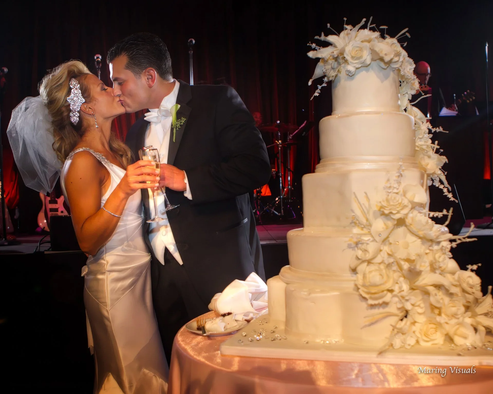 Bride and Groom Kiss After Cutting Wedding Cake at Cipriani 42nd Street