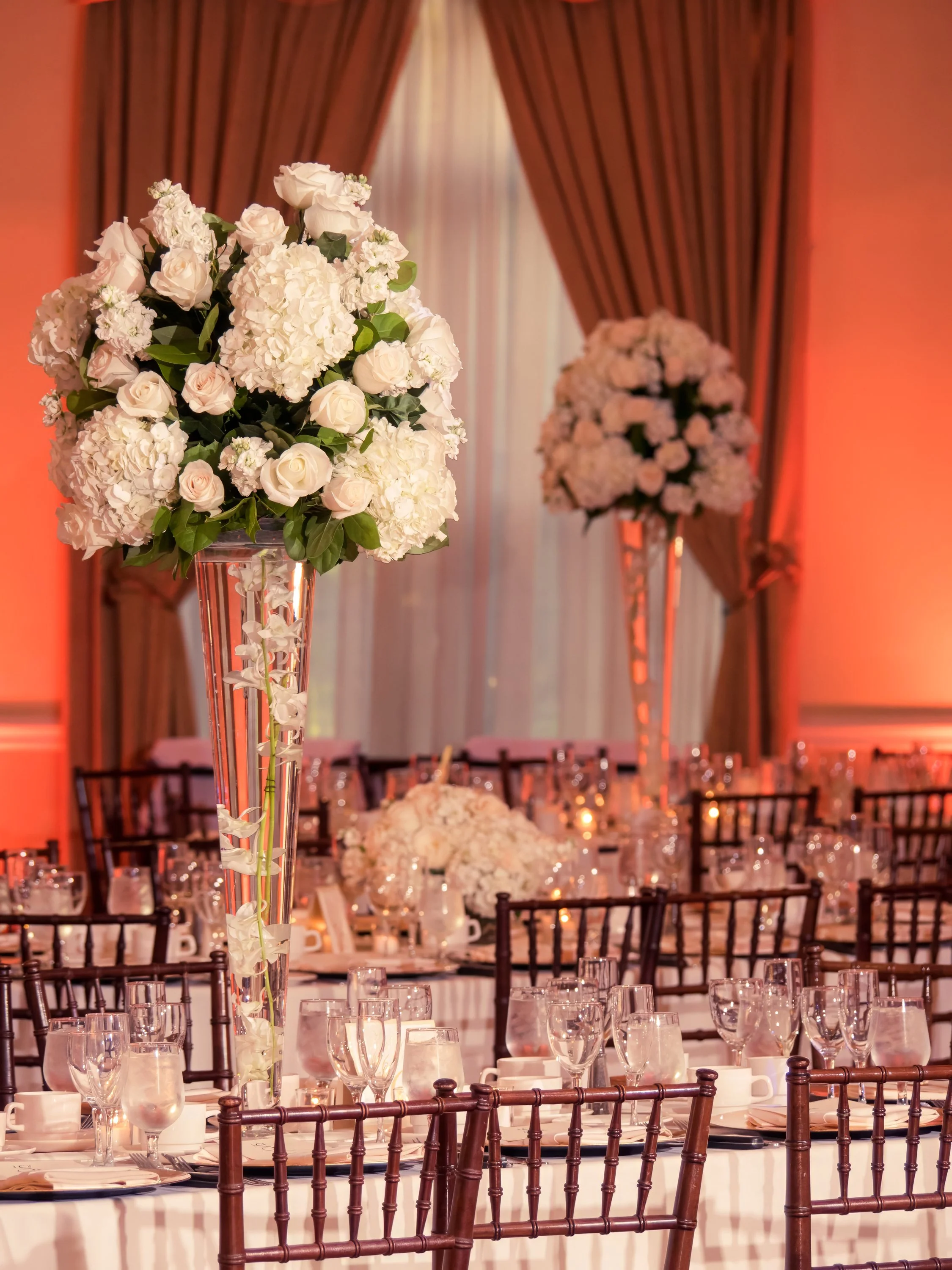 Tall floral centerpieces adorning tables in The Grandview Ballroom.