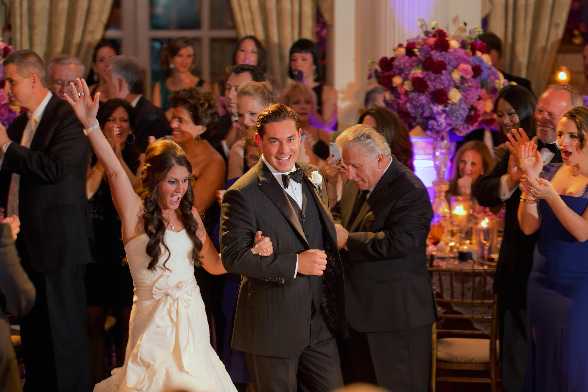 Grand entrance to a wedding reception in The Plaza Hotel ballroom with elegant décor and chandeliers.