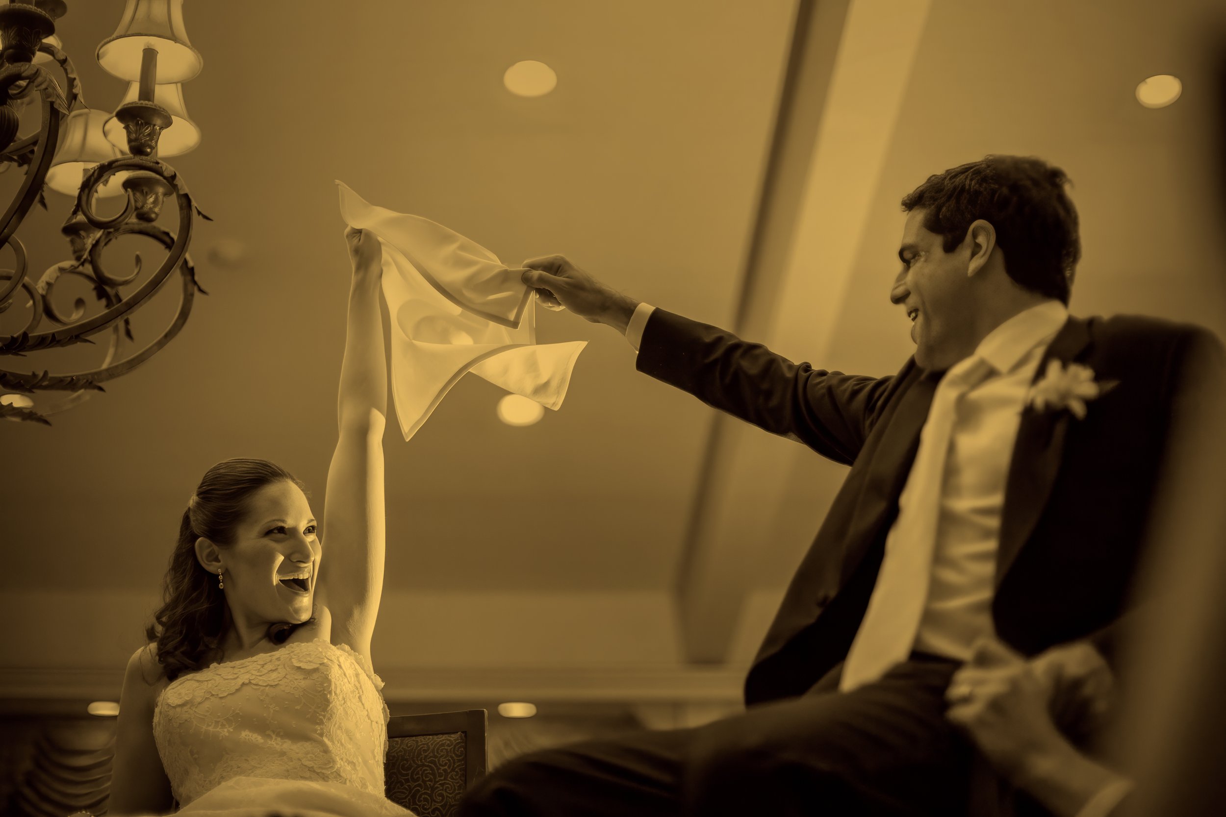 Bride and groom lifted in celebration during the traditional hora dance at a Newport wedding reception photographed by Maring Visuals.