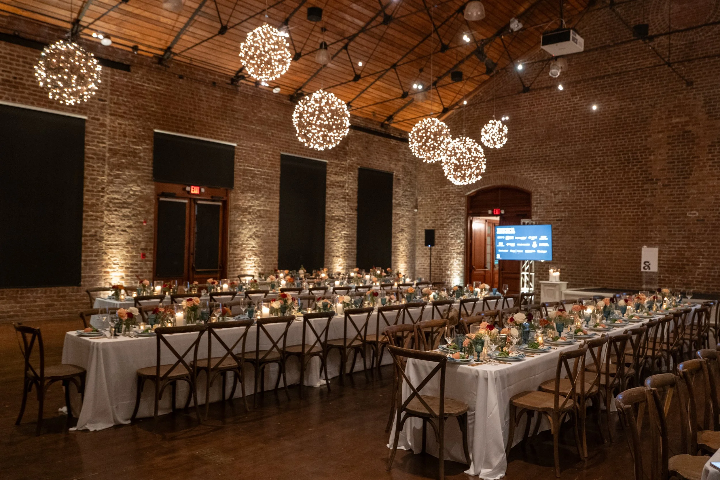 Corporate gala dinner tables arranged inside the historic Charles H. Morris Center in Savannah.