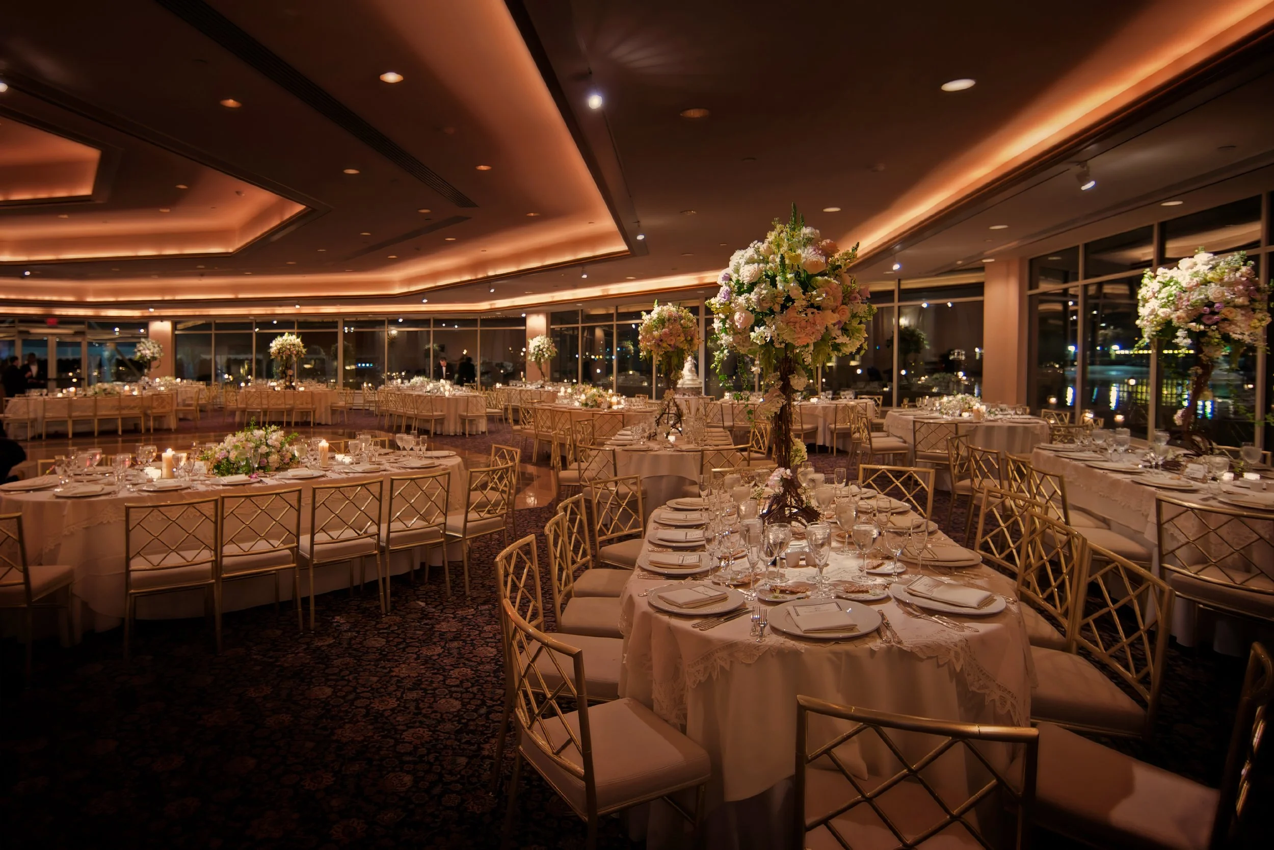 Ballroom at Glen Island Harbour Club lavishly decorated for a large wedding reception