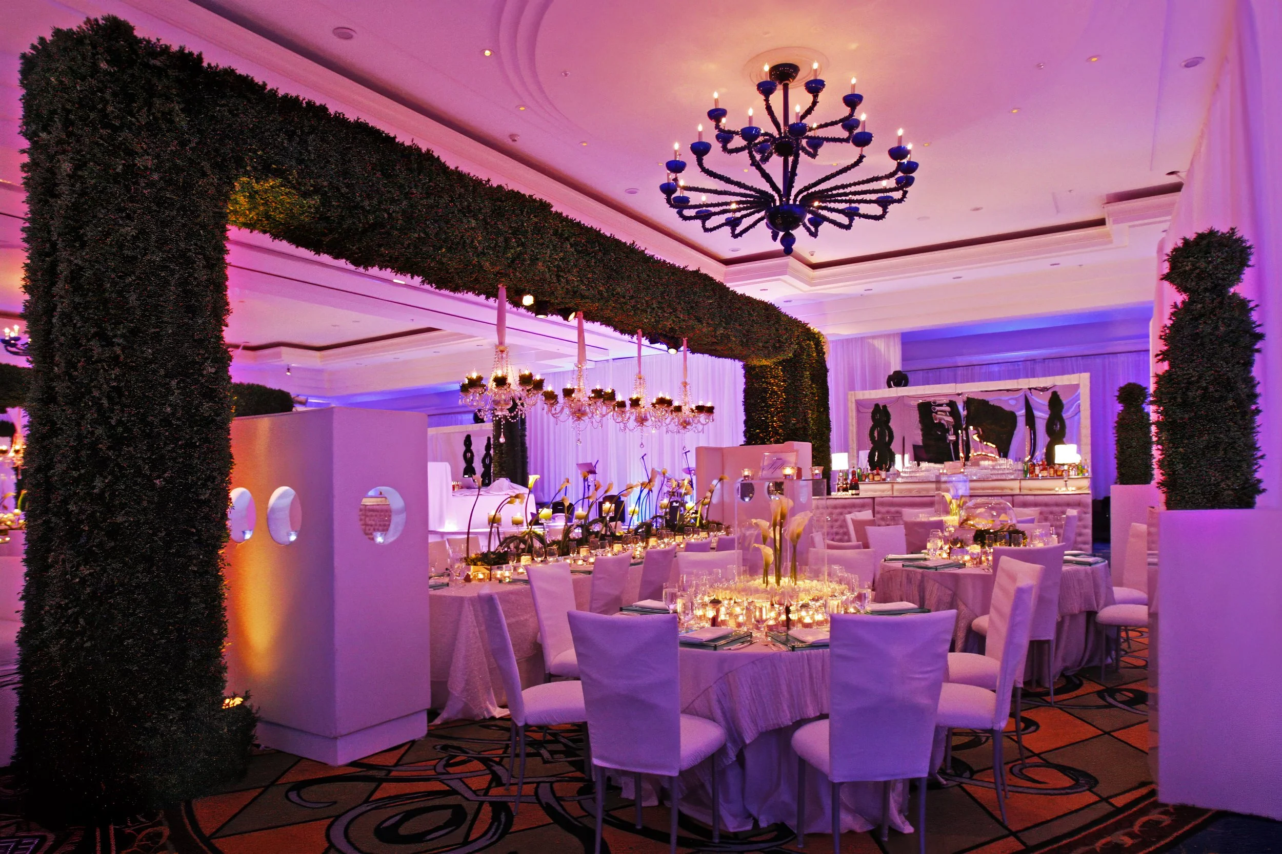 Lavish wedding reception decor at The Ritz-Carlton South Beach designed by David Tutera featuring luxury florals and dramatic lighting.