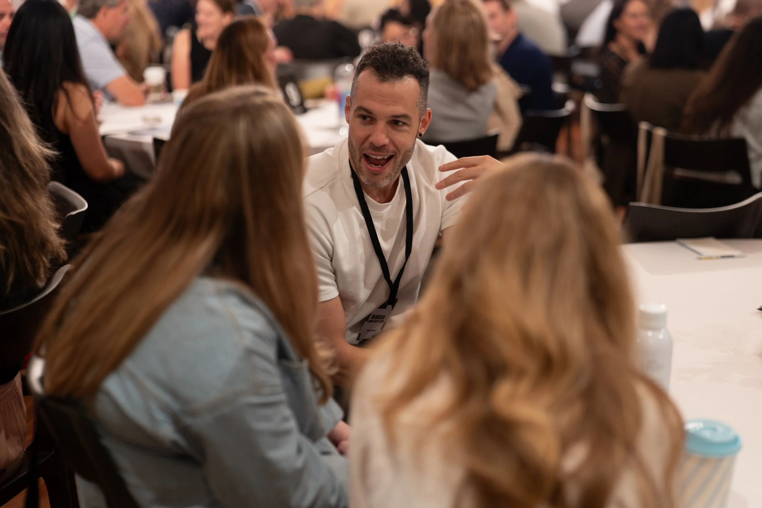 Conference attendees interacting during Stay and Gather at Recess Hotel & Club.