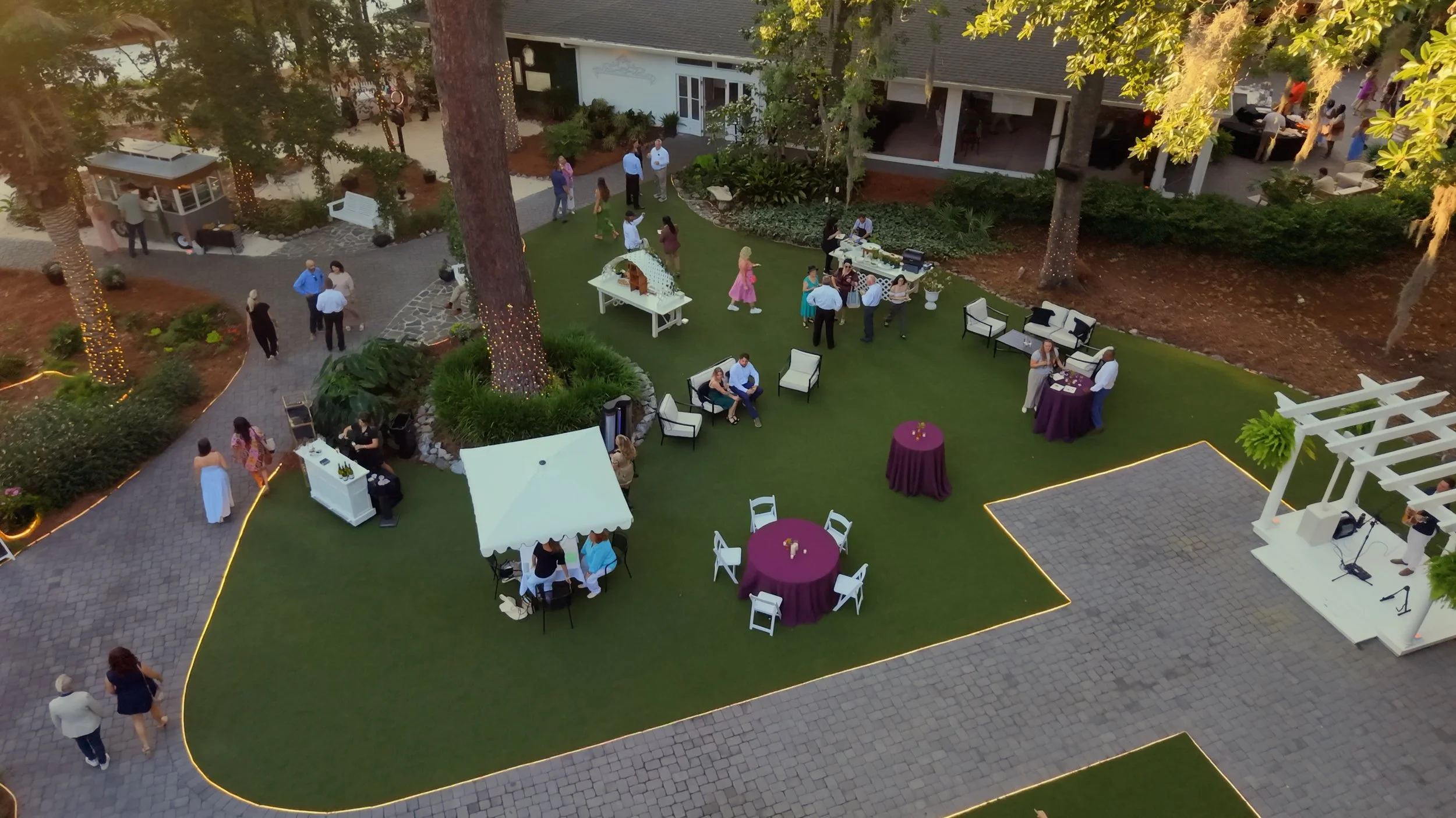 Aerial view of guests interacting during a corporate event at The Mackey House event venue in Savannah Georgia.