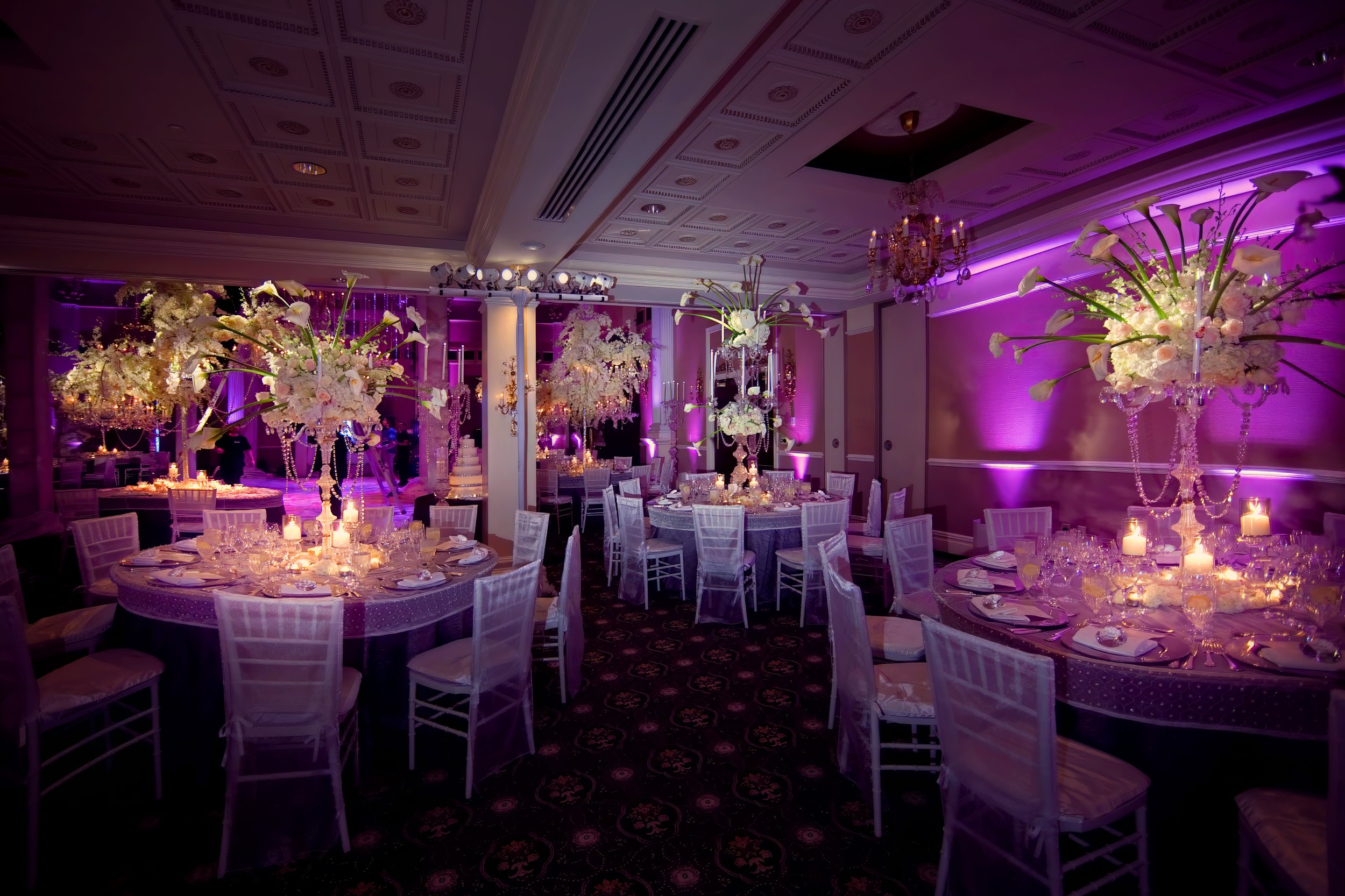 Expansive view of luxurious floral arrangements decorating the ballroom at The Palace at Somerset Park.