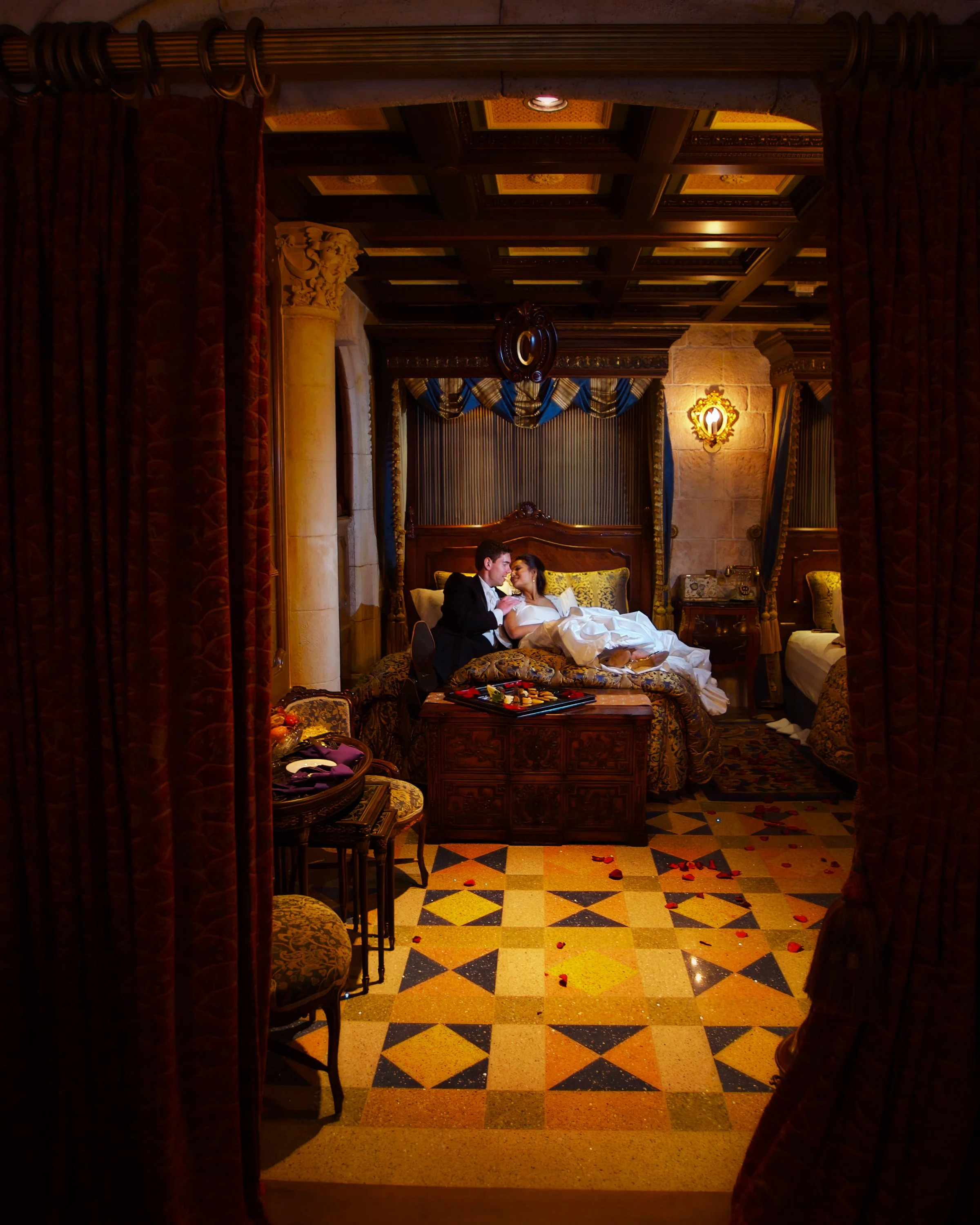 Bride and groom portrait inside Cinderella’s Royal Suite at Walt Disney World during their wedding celebration.