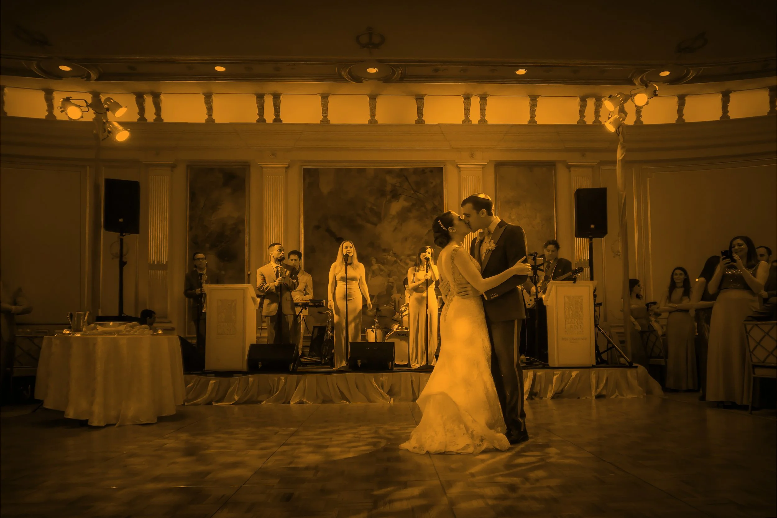 Bride and groom sharing first dance kiss in the Villard Ballroom at Lotte New York Palace Hotel