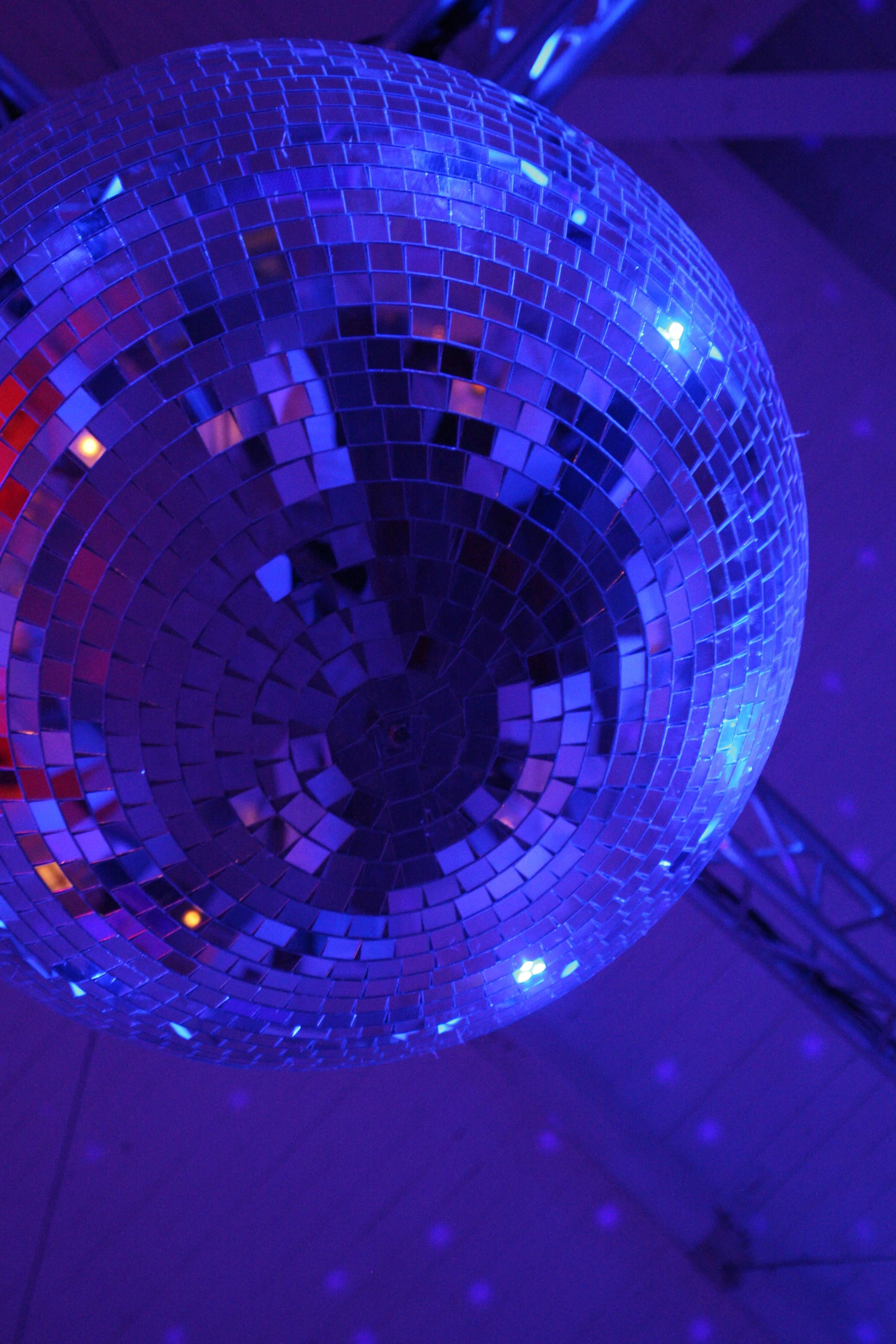 Disco ball reflecting light during a wedding celebration at Nikki Beach in Miami.