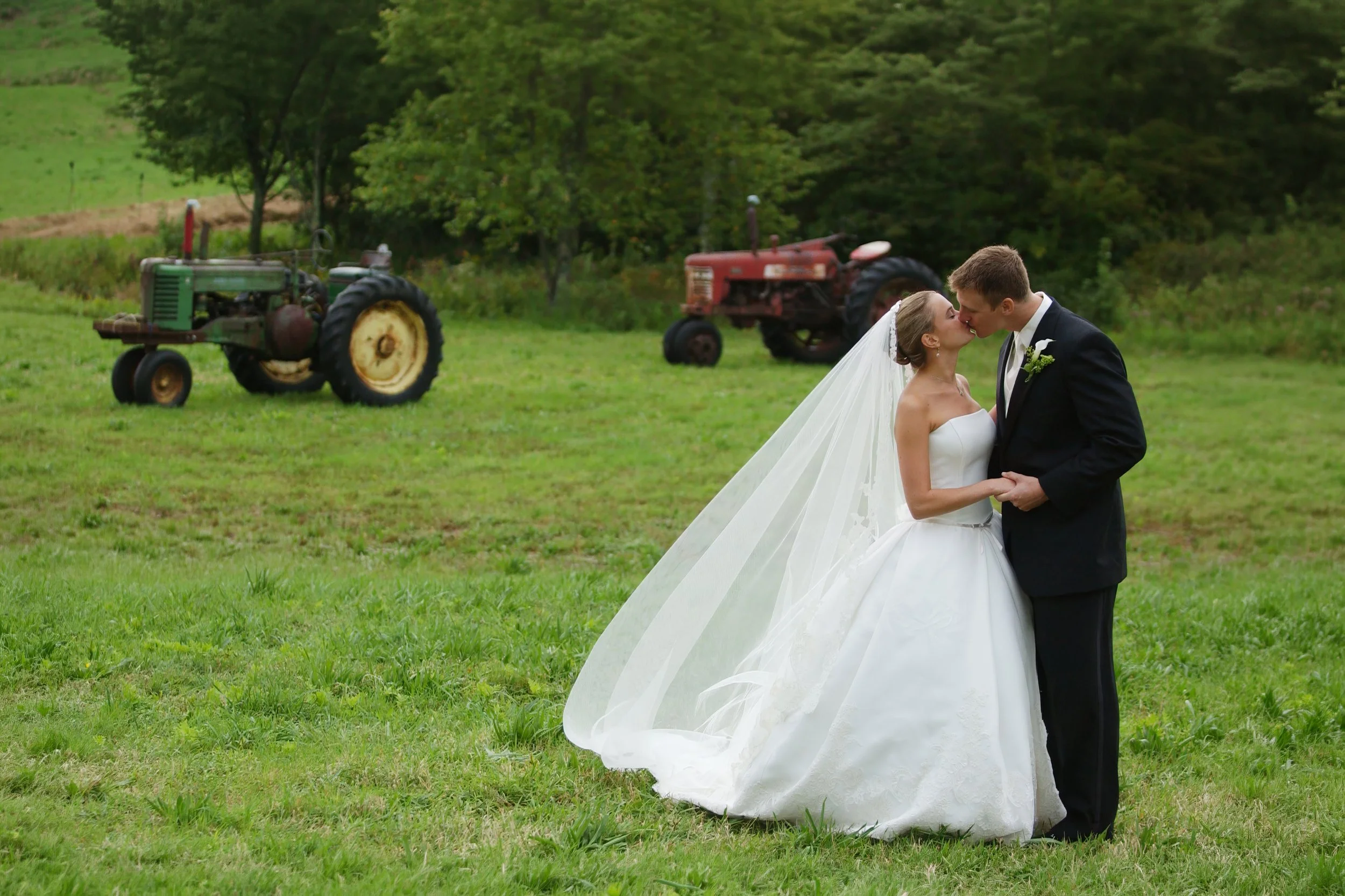 Bride and groom kissing on the grounds of a private farm estate wedding in Hartford County Connecticut.